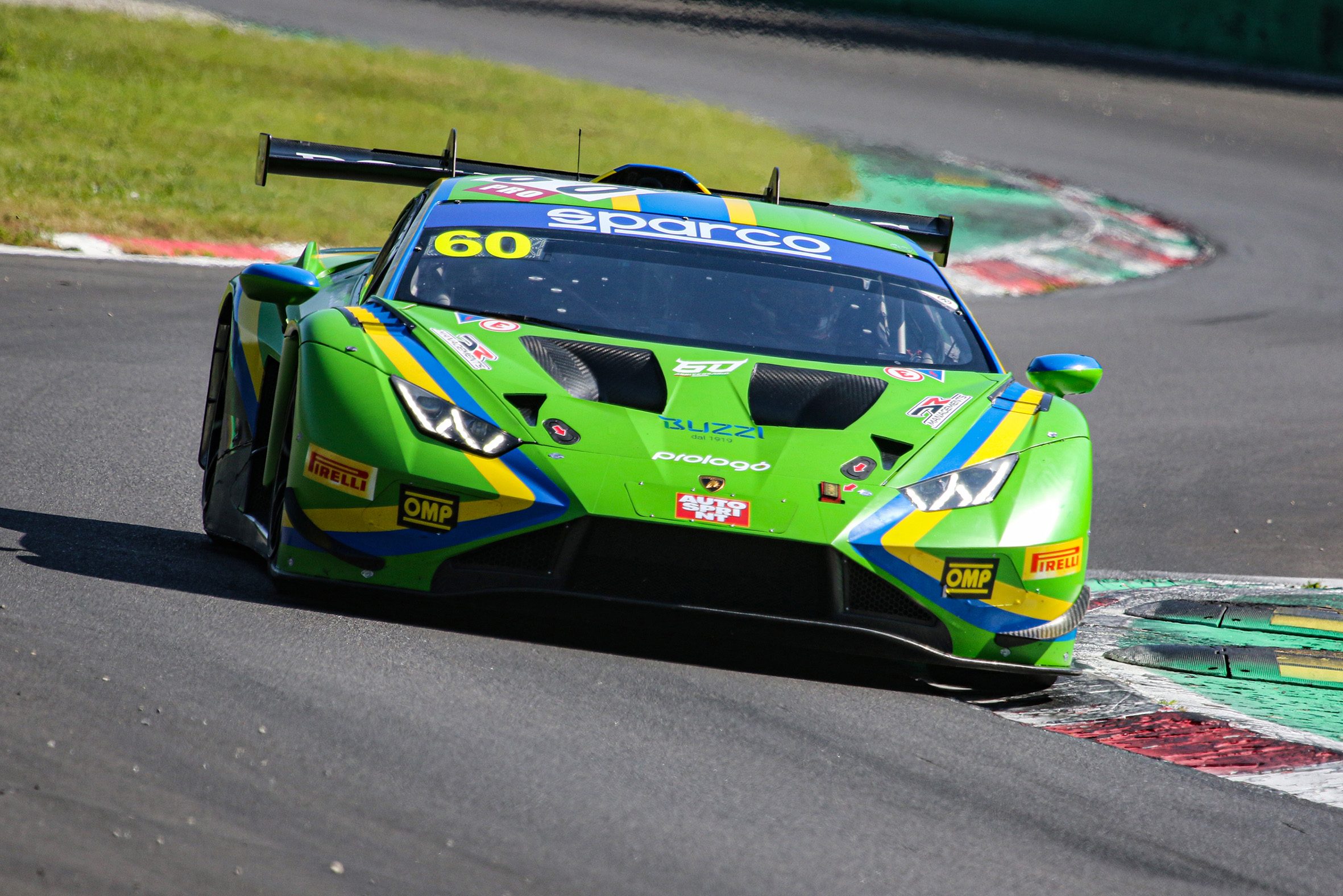 Huracán Gt3 Evo2 Wins On Debut At Monza, Proving Lamborghini'S Customer Racer Arrived Ready 5 Green lamborghini huracán gt3 evo2 navigating a turn at monza showing aggressive front splitter and vented hood
