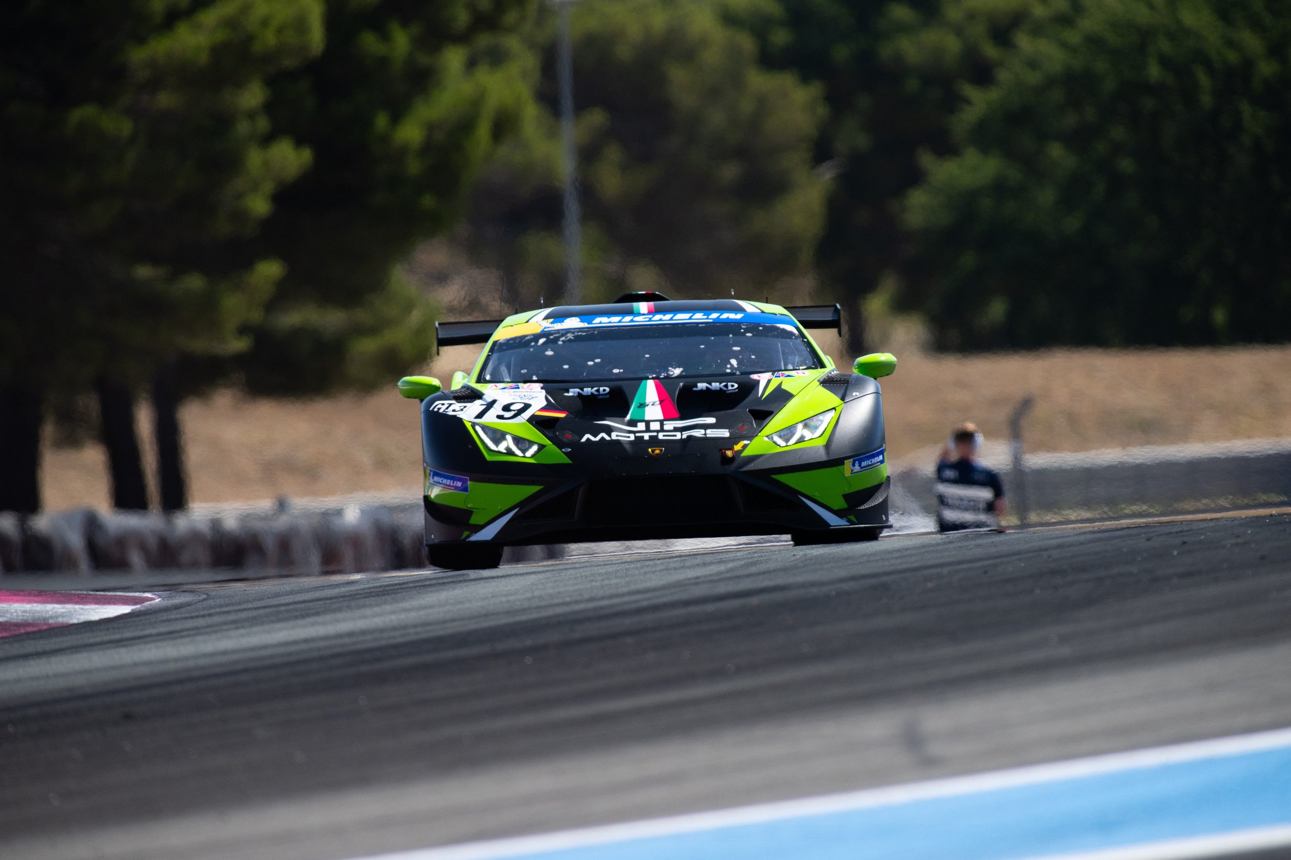 Huracán Gt3 Evo2 Scores Double Weekend Wins As Lamborghini Hits 50Th Adac Gt Masters Pole 3 Green and black lamborghini huracán gt3 evo2 number 19 approaching head-on on track