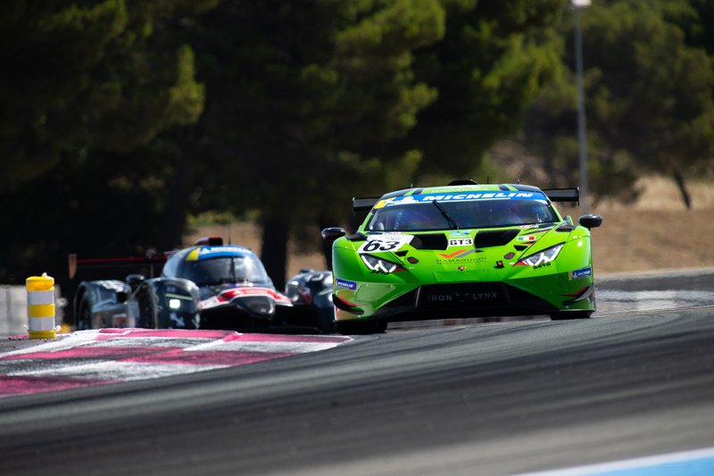 Green Lamborghini Huracán GT3 EVO2 number 63 leading a competitor on track