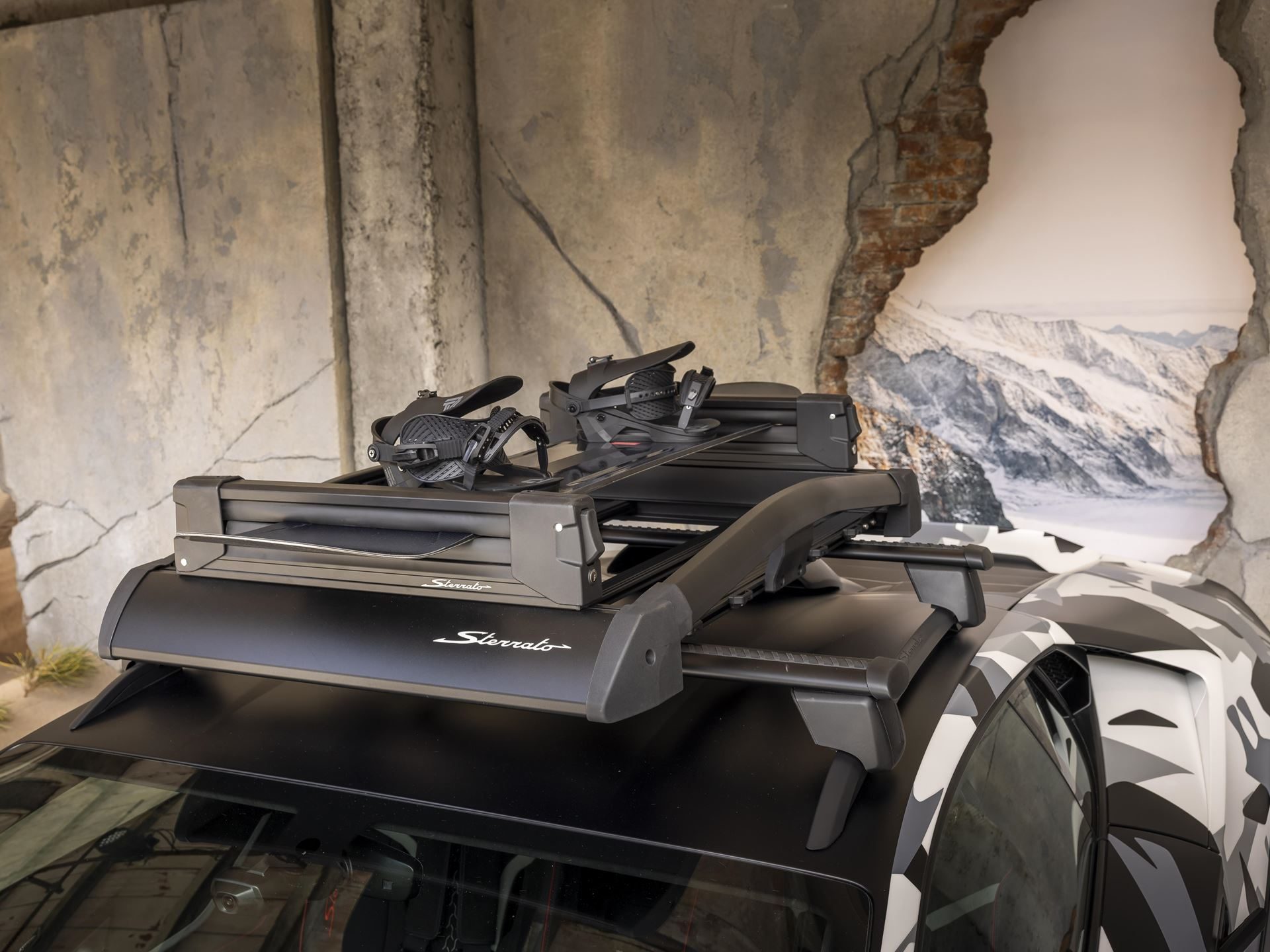 Twelve Camouflaged Sterrattos, A Michelin-Starred Dinner, And Tod'S Loafers: Inside Lamborghini'S Milan Design Week Power Play 9 Close-up of the huracán sterrato roof rack with two snowboards mounted, demonstrating the car's adventure utility