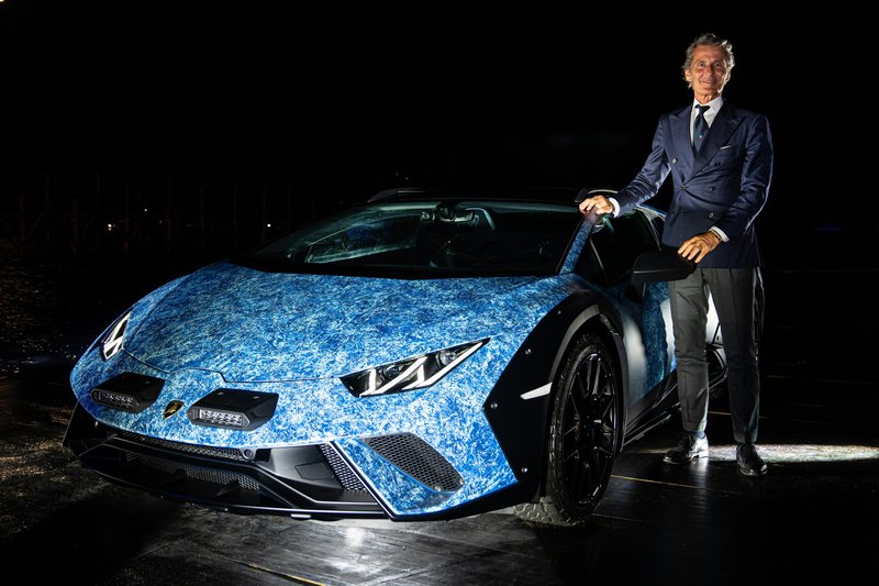 Stephan Winkelmann stands beside the blue marbled Lamborghini Huracán Sterrato Opera Unica at its Porto Cervo unveiling