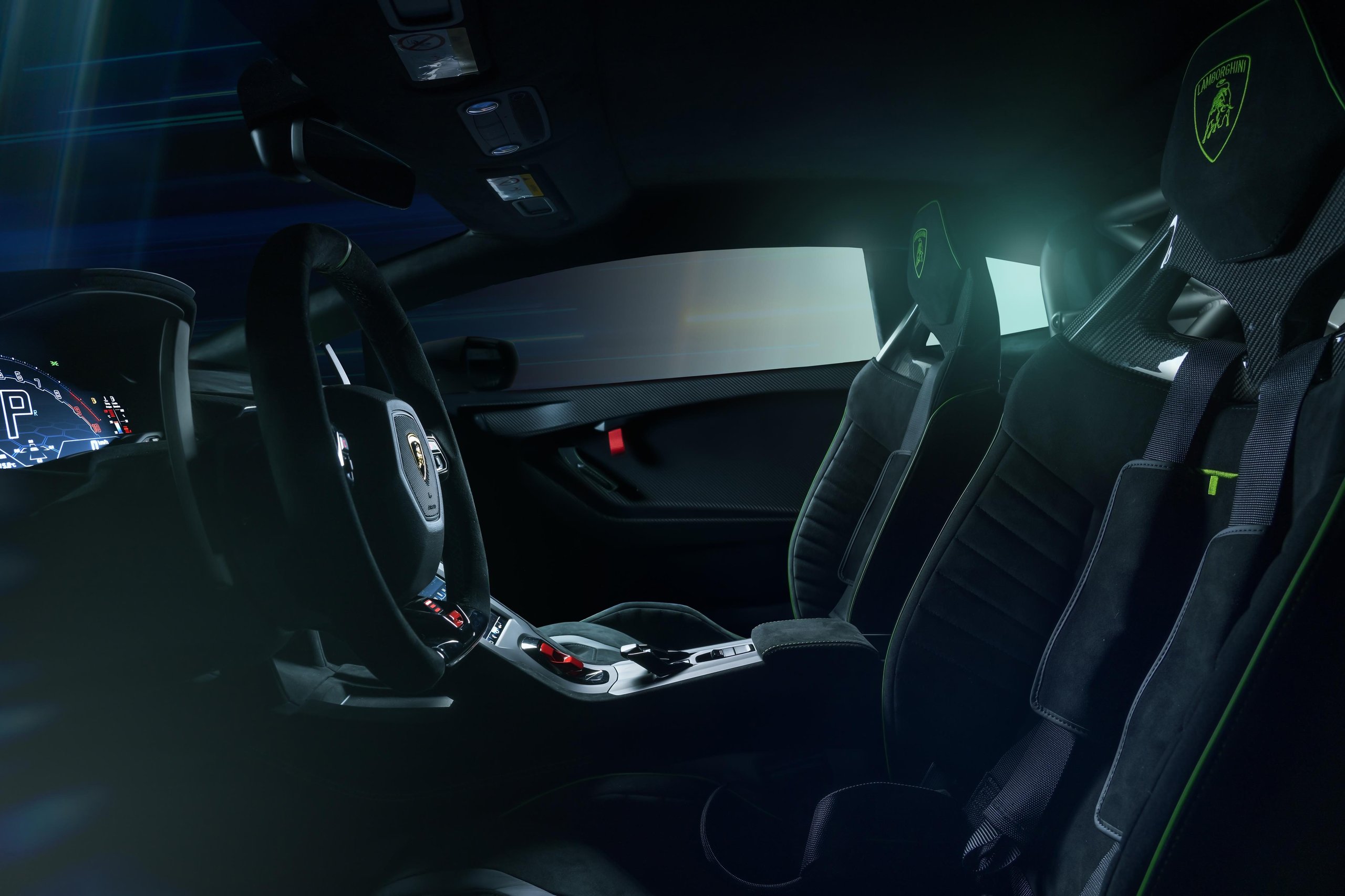 Squadra Corse'S First Road-Car Performance Kit Turns The Huracán Sto Into A Factory-Built Track Weapon 9 Interior of huracán sto sc 10° anniversario showing racing bucket seats with green stitching, multi-point harnesses, and carbon fiber accents