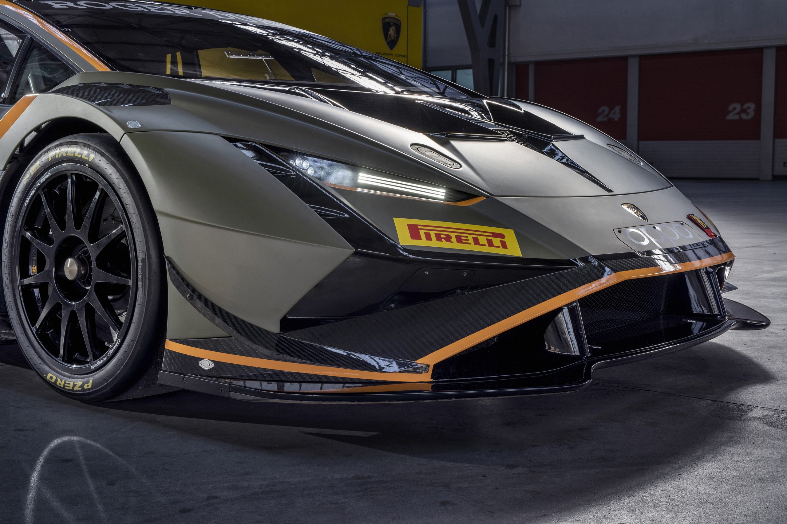 The Huracán Super Trofeo Evo2 Previews Lamborghini'S Next Design Language From The Track 5 Close-up detail of the huracán super trofeo evo2 front section showing led headlight, carbon fiber splitter, and racing wheel with pirelli branding
