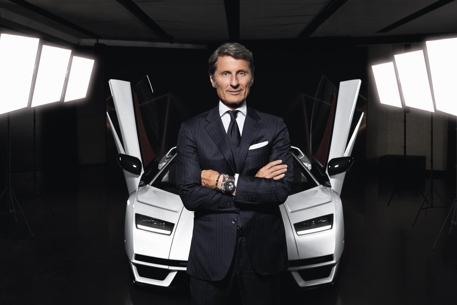 Stephan Winkelmann, CEO of Automobili Lamborghini, standing in front of a white Countach LPI 800-4