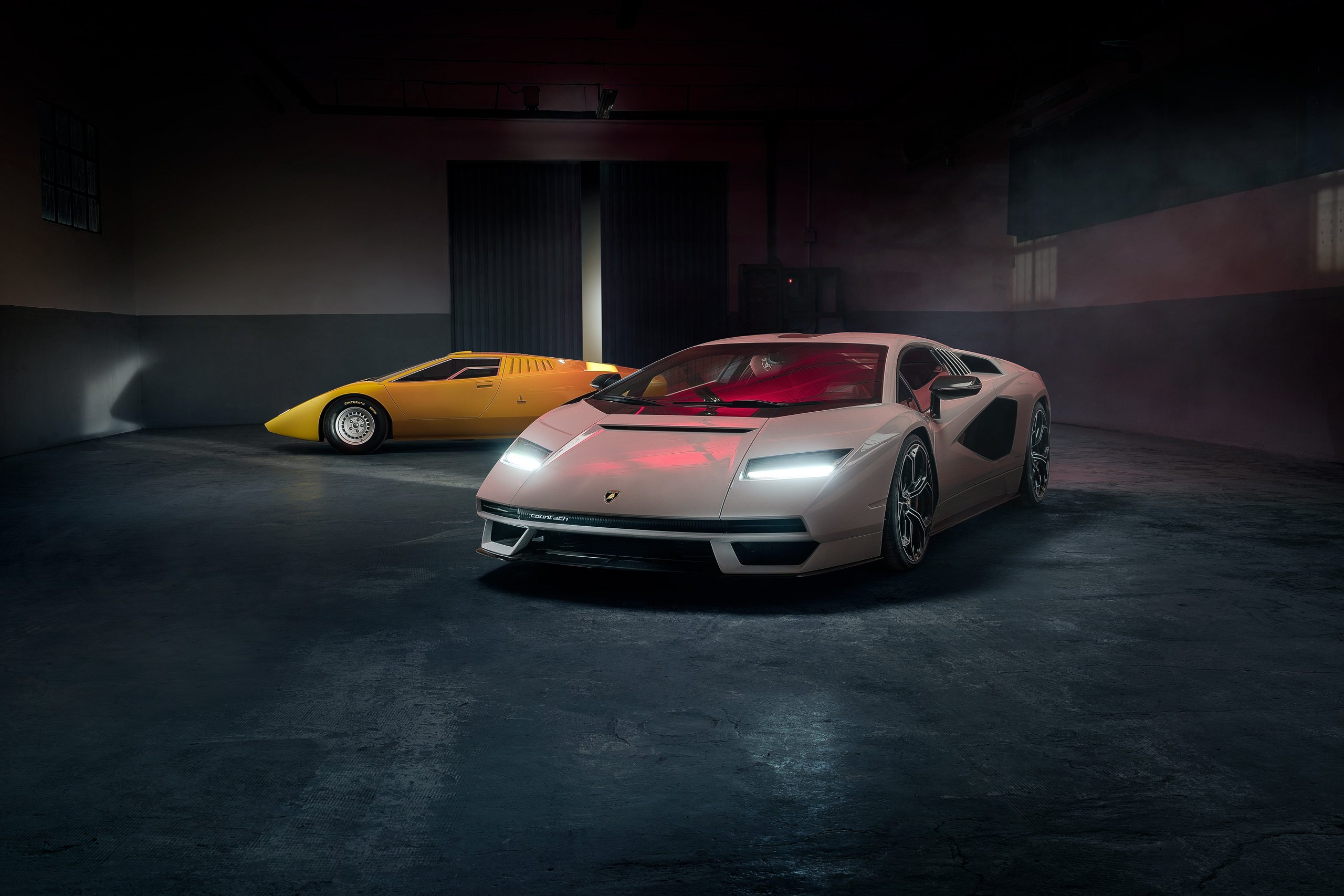 How 8,405 Cars And One Suv Are Funding Lamborghini'S €1.5 Billion Bet On Electrification 9 White lamborghini countach lpi 800-4 parked in front of a classic yellow countach lp400 in a dimly lit studio