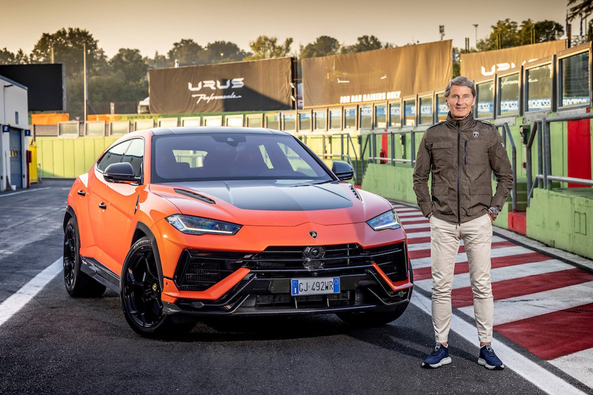 How Lamborghini'S Record 2022 Financials Bankrolled A Hybrid Revolution That Rivals Still Chase 3 Lamborghini urus performante in arancio borealis on a racetrack pit lane with urus performante branding visible