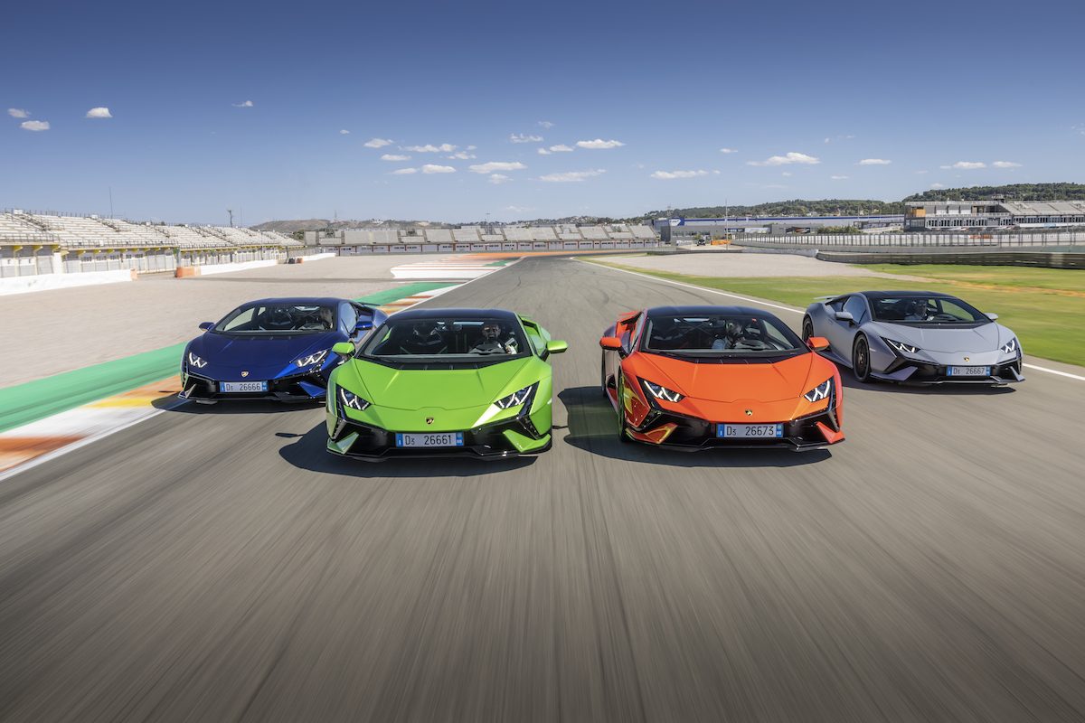 How Lamborghini'S Record 2022 Financials Bankrolled A Hybrid Revolution That Rivals Still Chase 7 Four lamborghini huracán models in blue, green, orange, and grey lined up on a race track under a clear sky