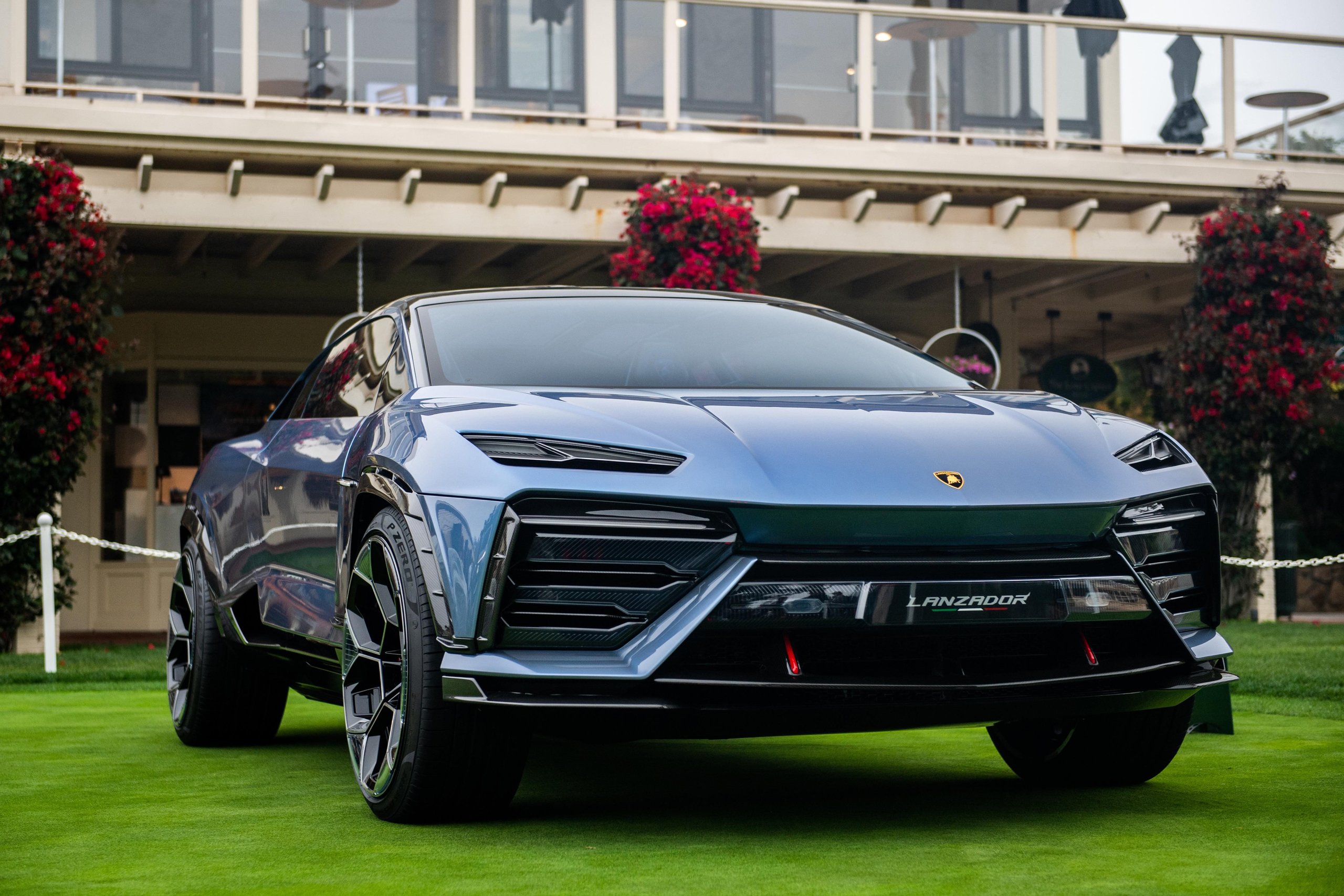 Low-angle front view of the blue lamborghini lanzador concept car on a manicured lawn