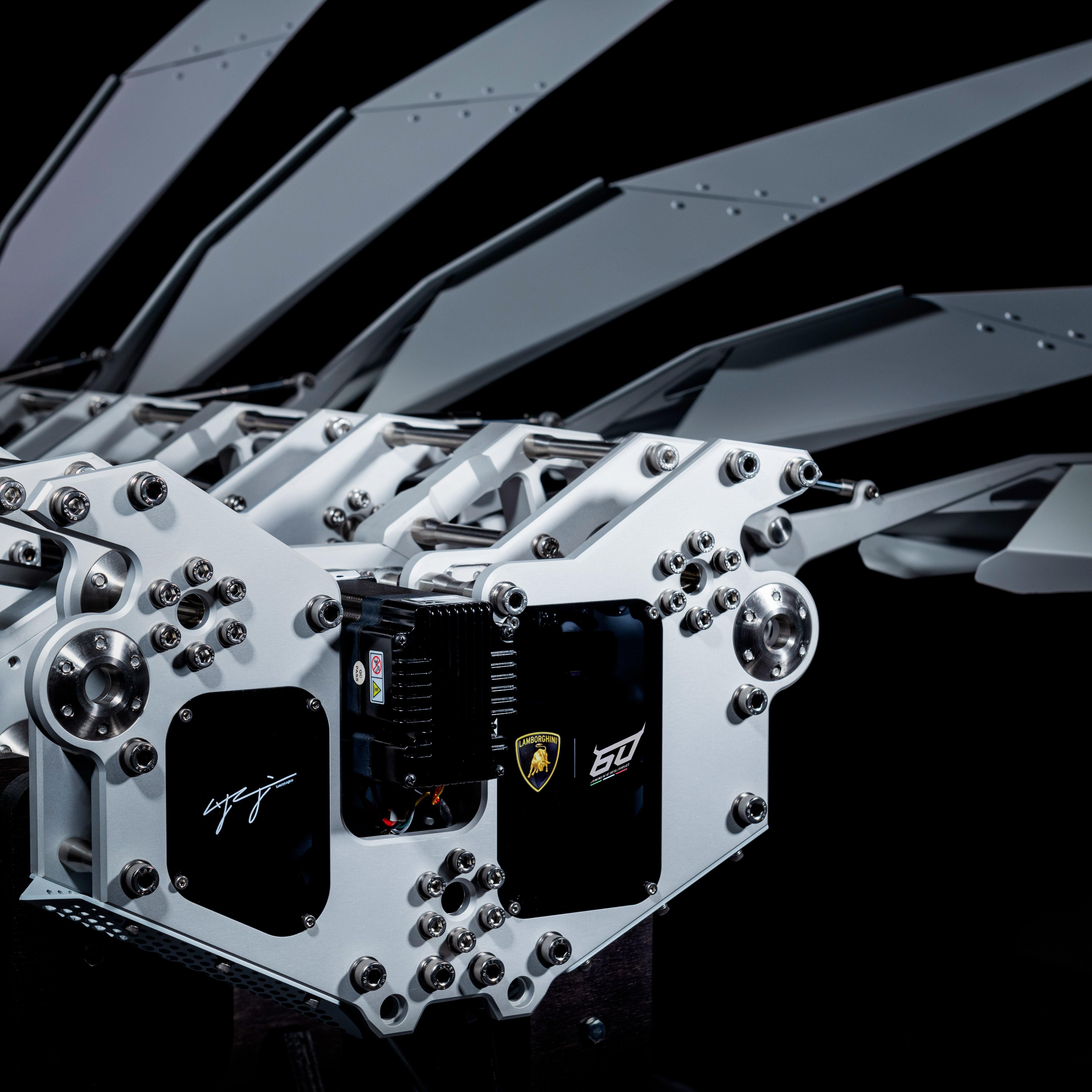 Seventy Lamborghinis, One Kinetic Sculpture, And Taiwan'S Eastern Coast: Inside The 60Th Anniversary Esperienza Giro 5 Close-up of the ll60 kinetic sculpture's mechanical core showing precision gears, bolts, and the lamborghini 60th-anniversary logo
