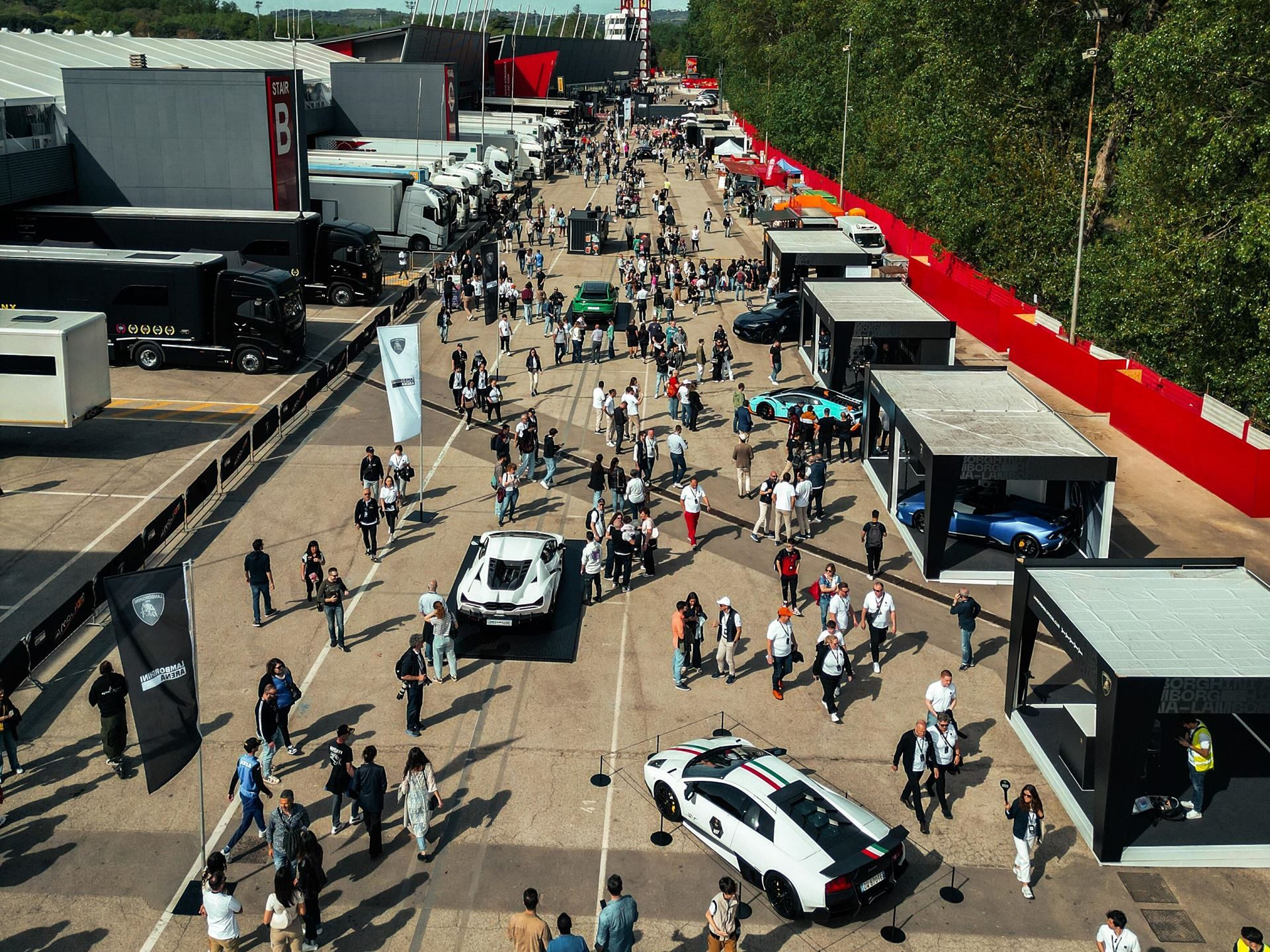 Lamborghini Arena 2026 Returns To Imola With Super Trofeo Racing, Miura Anniversary, And A Bigger Playbook 7 Aerial view of the lamborghini arena event space filled with cars, crowds, tents, and brand structures