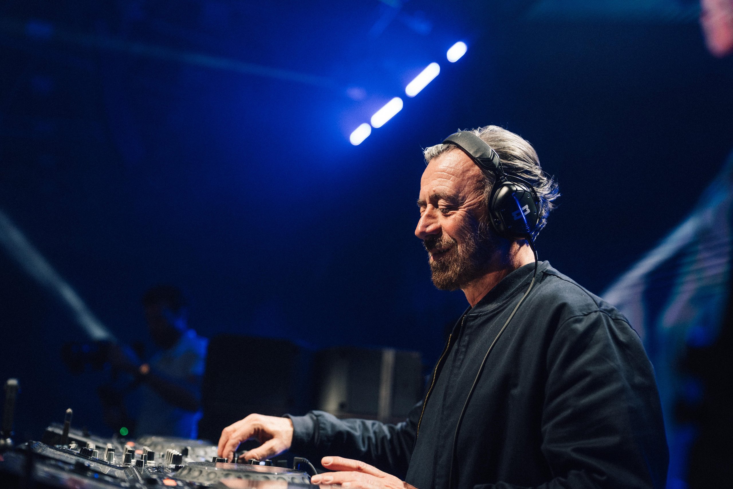 Why Lamborghini Hired Benny Benassi To Turn Arena Into A Homecoming For 6,000 Owners 9 Dj benny benassi focused on his mixing console during the lamborghini arena performance with blue light background