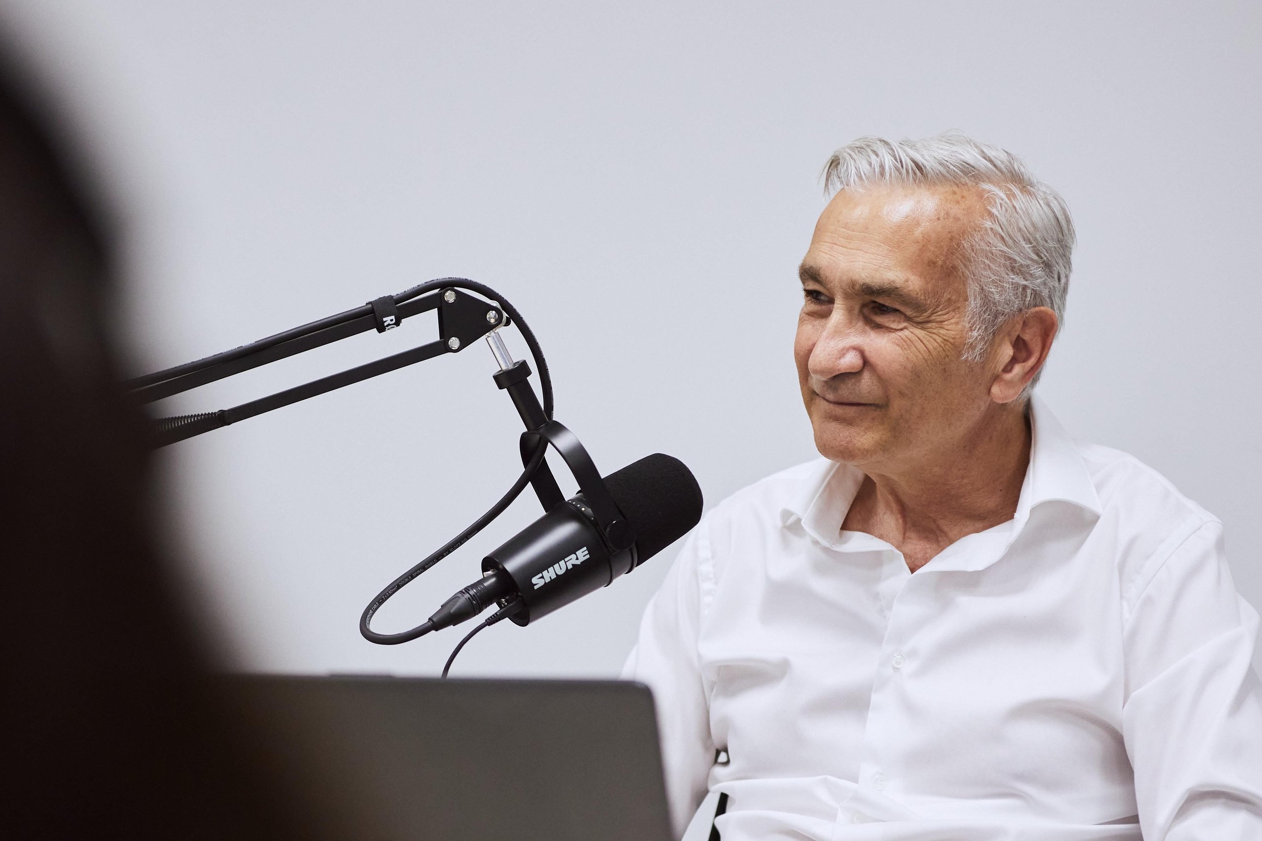 Inside Lamborghini'S 'Beyond' Podcast: How The Revuelto'S Product Director And Ducati'S Motogp Boss Define Winning Culture 5 Davide tardozzi, ducati motogp team manager, smiling during the beyond podcast recording with a professional microphone in the foreground