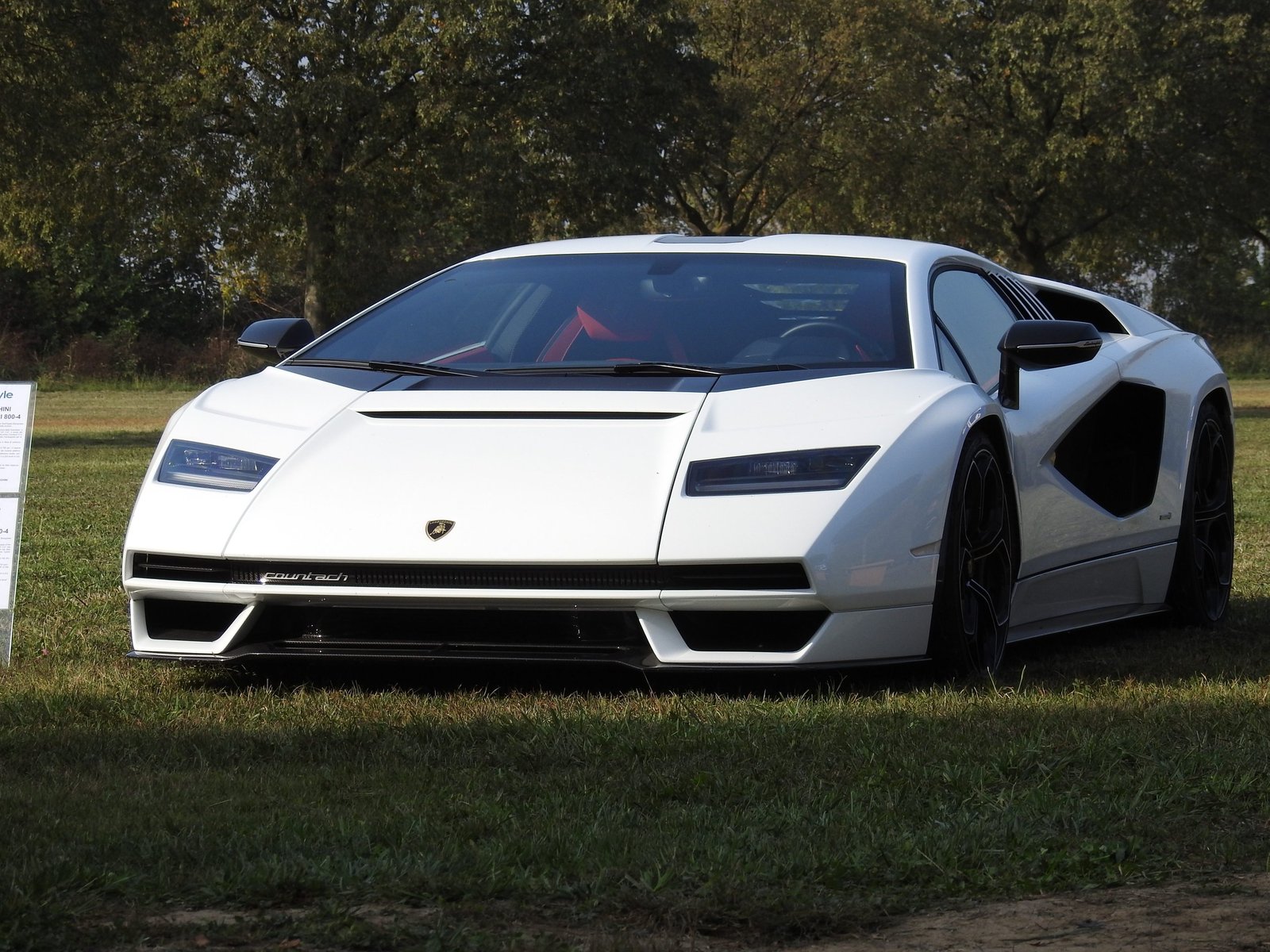 White Lamborghini Countach LPI 800-4 displayed on green grass at the Autostyle Design Competition venue