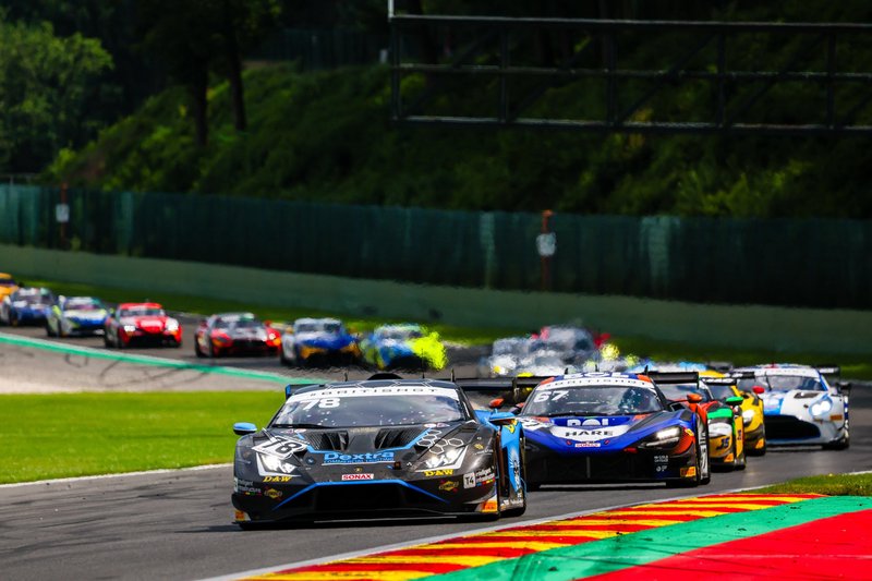 Lamborghini Huracán GT3 EVO2 leading a pack of race cars on track at Spa-Francorchamps during the British GT Championship