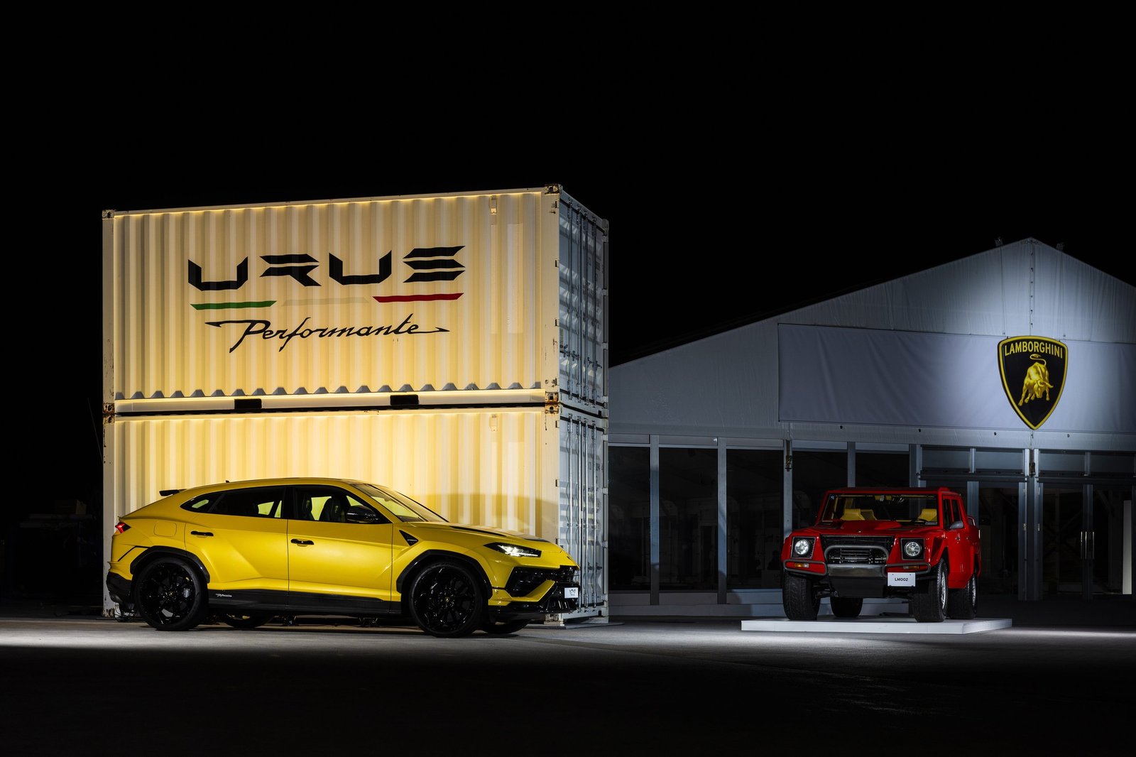 Yellow Lamborghini Urus Performante displayed next to a red Lamborghini LM002 at Lamborghini Day Japan 2022