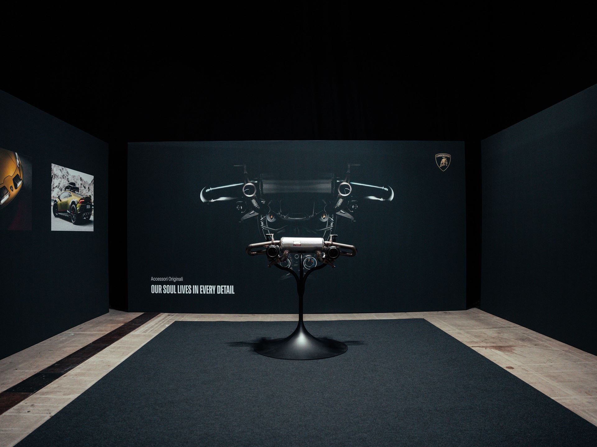 Lamborghini Day Uk Turned A Hybrid Reveal Into A Full Brand Experience, And That Was The Point 5 Lamborghini urus se exhaust system displayed as a sculptural piece in a dark studio setting