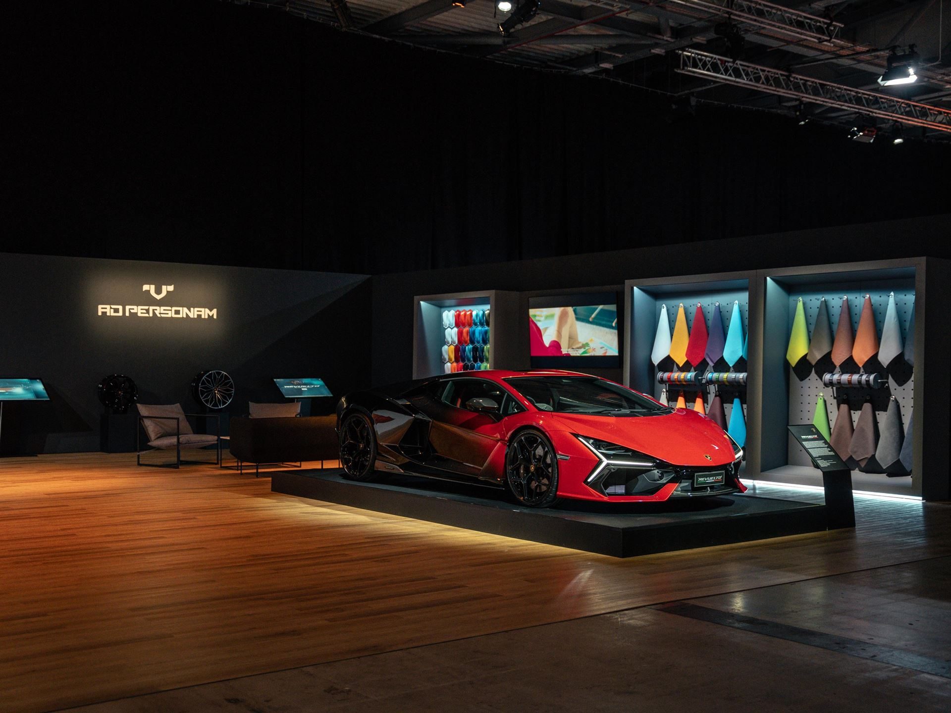 Lamborghini Day Uk Turned A Hybrid Reveal Into A Full Brand Experience, And That Was The Point 7 Red lamborghini revuelto displayed beside an ad personam customization area with material samples at lamborghini day uk 2024