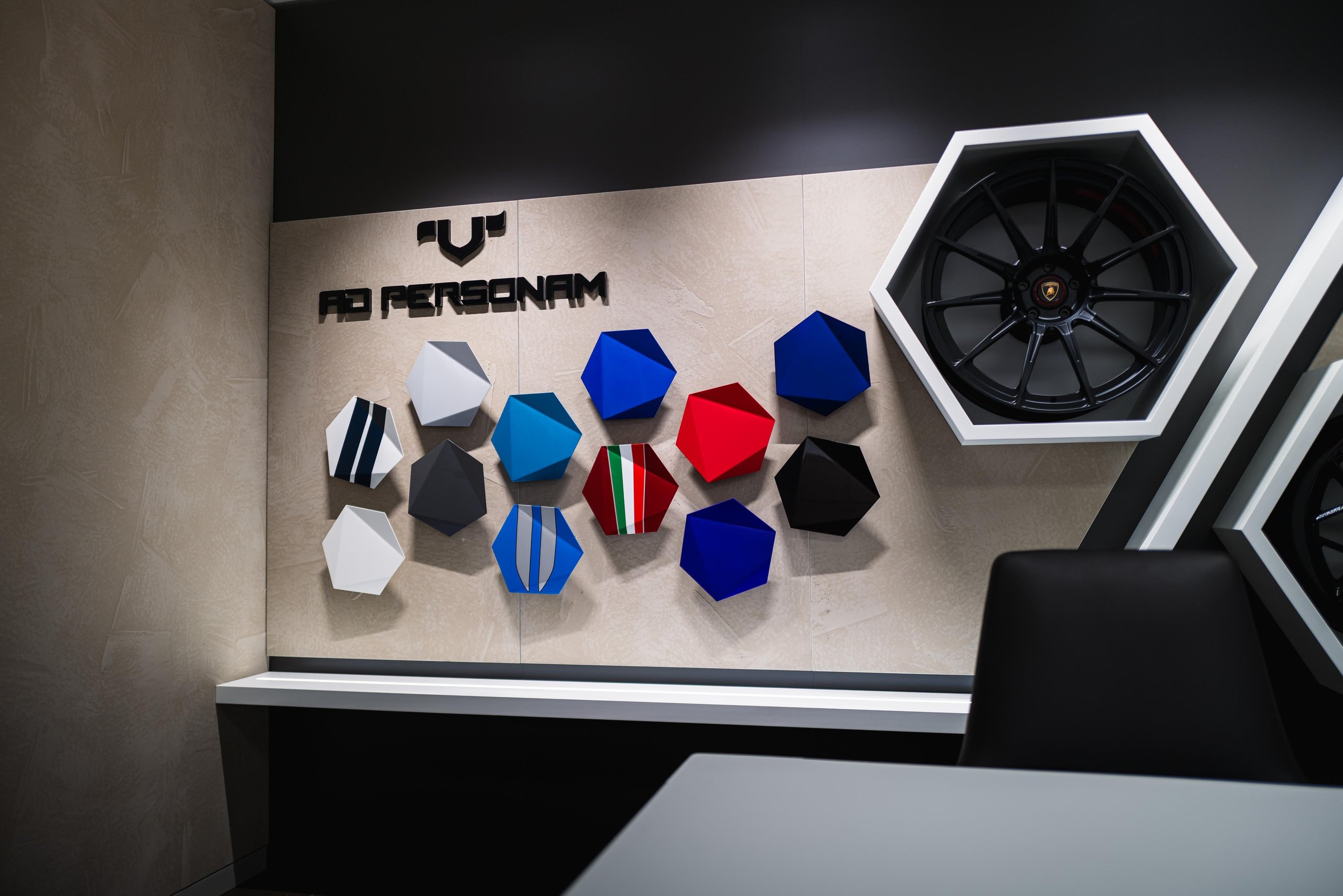 Lamborghini Plants Its Flag On Belgium'S Wealthiest Coastline With A New Knokke Showroom 9 The ad personam display wall at lamborghini knokke showing hexagonal paint and material samples alongside an alloy wheel