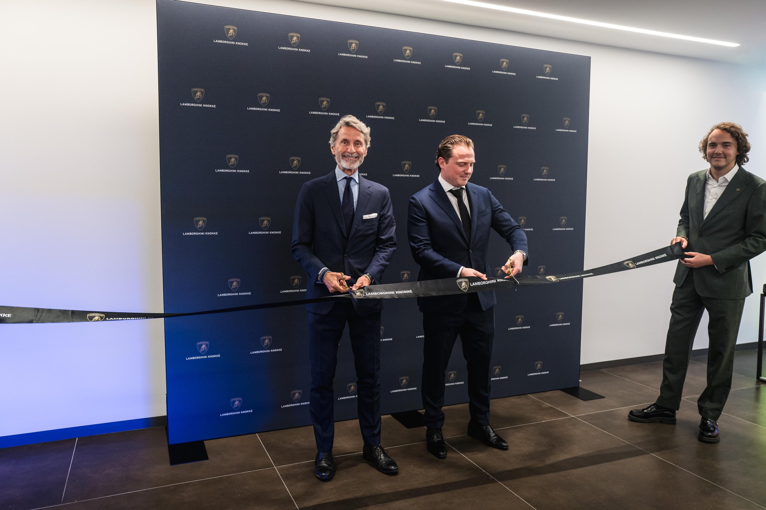 Lamborghini Plants Its Flag On Belgium'S Wealthiest Coastline With A New Knokke Showroom 3 Three executives cutting the lamborghini knokke branded ribbon at the official dealership inauguration ceremony