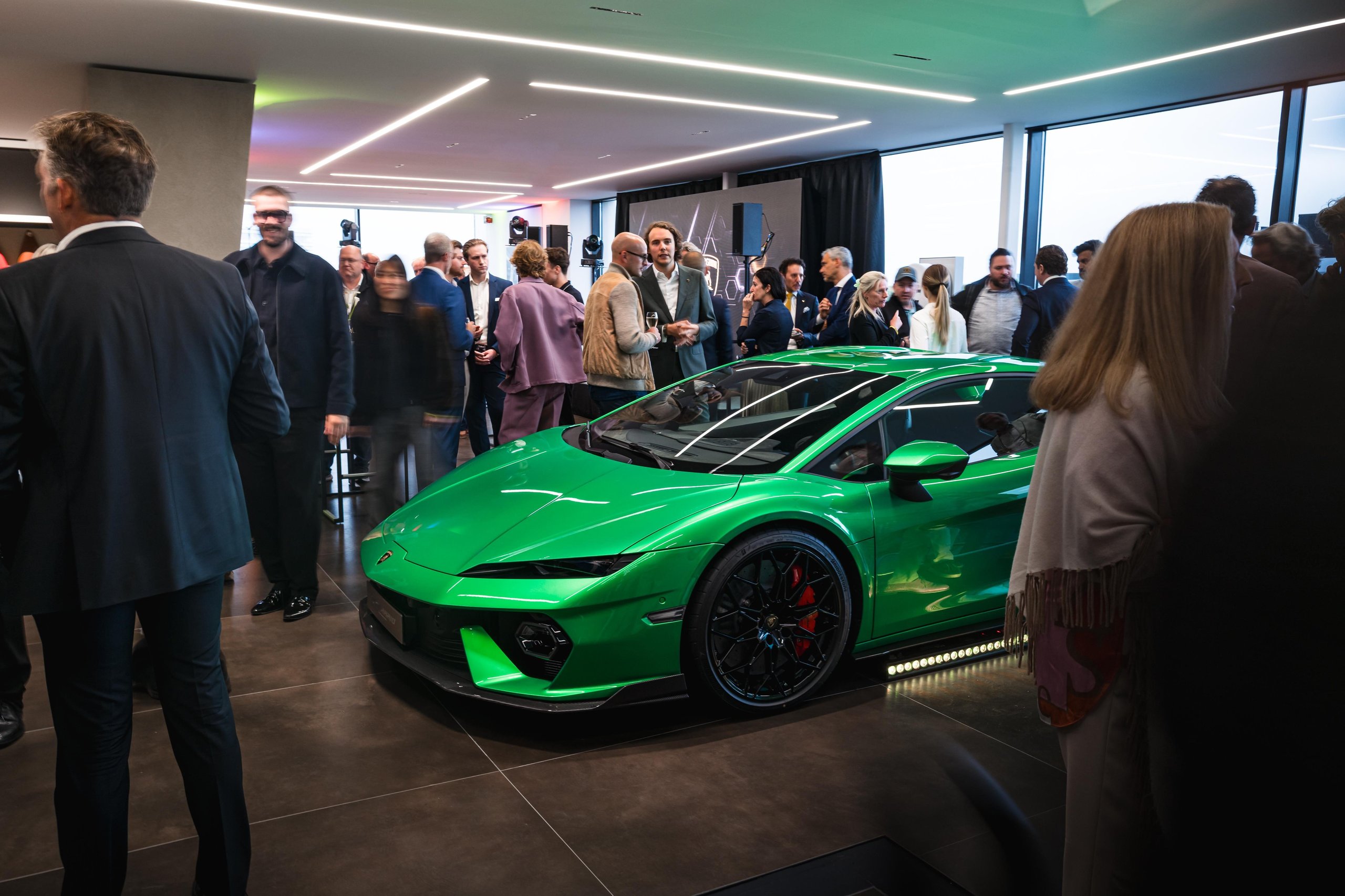 Lamborghini Plants Its Flag On Belgium'S Wealthiest Coastline With A New Knokke Showroom 11 A green lamborghini temerario surrounded by guests at the busy knokke dealership launch event