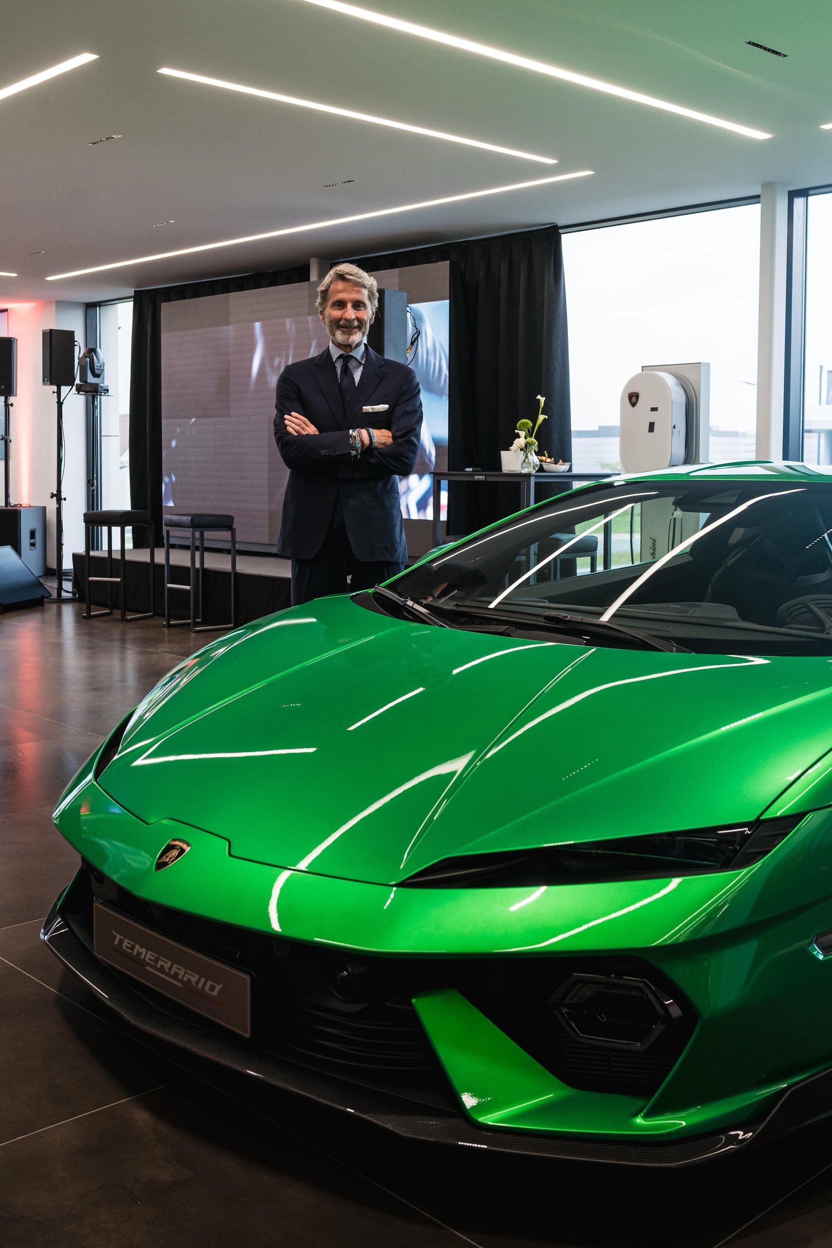 Lamborghini Plants Its Flag On Belgium'S Wealthiest Coastline With A New Knokke Showroom 13 An executive standing behind a green lamborghini temerario in the modern knokke showroom