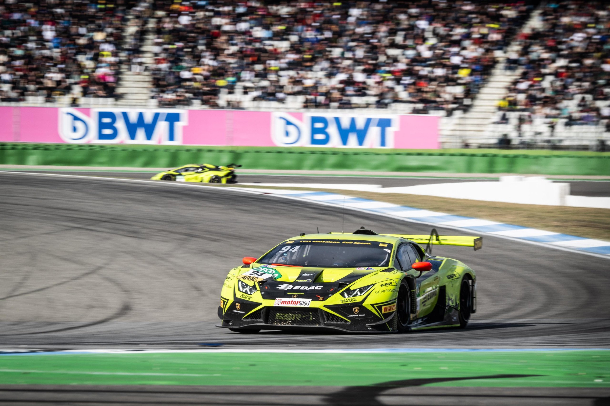 Five Wins, One Near-Miss Title: How The Huracán Gt3 Evo2 Delivered Lamborghini'S Best Dtm Season Yet 3 Lamborghini huracán gt3 evo2 number 94 cornering on a dtm racetrack with aggressive front splitter and rear wing visible