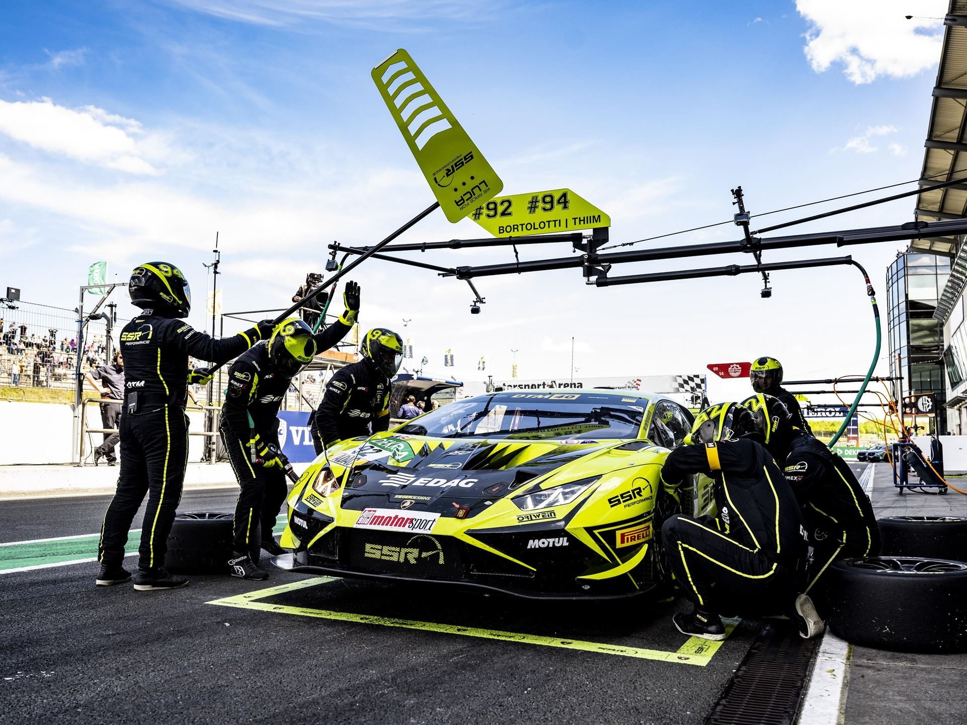Engstler'S Three-Tenths Margin At Oschersleben Reveals Why The Huracán Gt3 Evo2 Still Bites 5 Pit crew working on mirko bortolotti's #92 yellow and black lamborghini huracán gt3 evo2 during a dtm pit stop