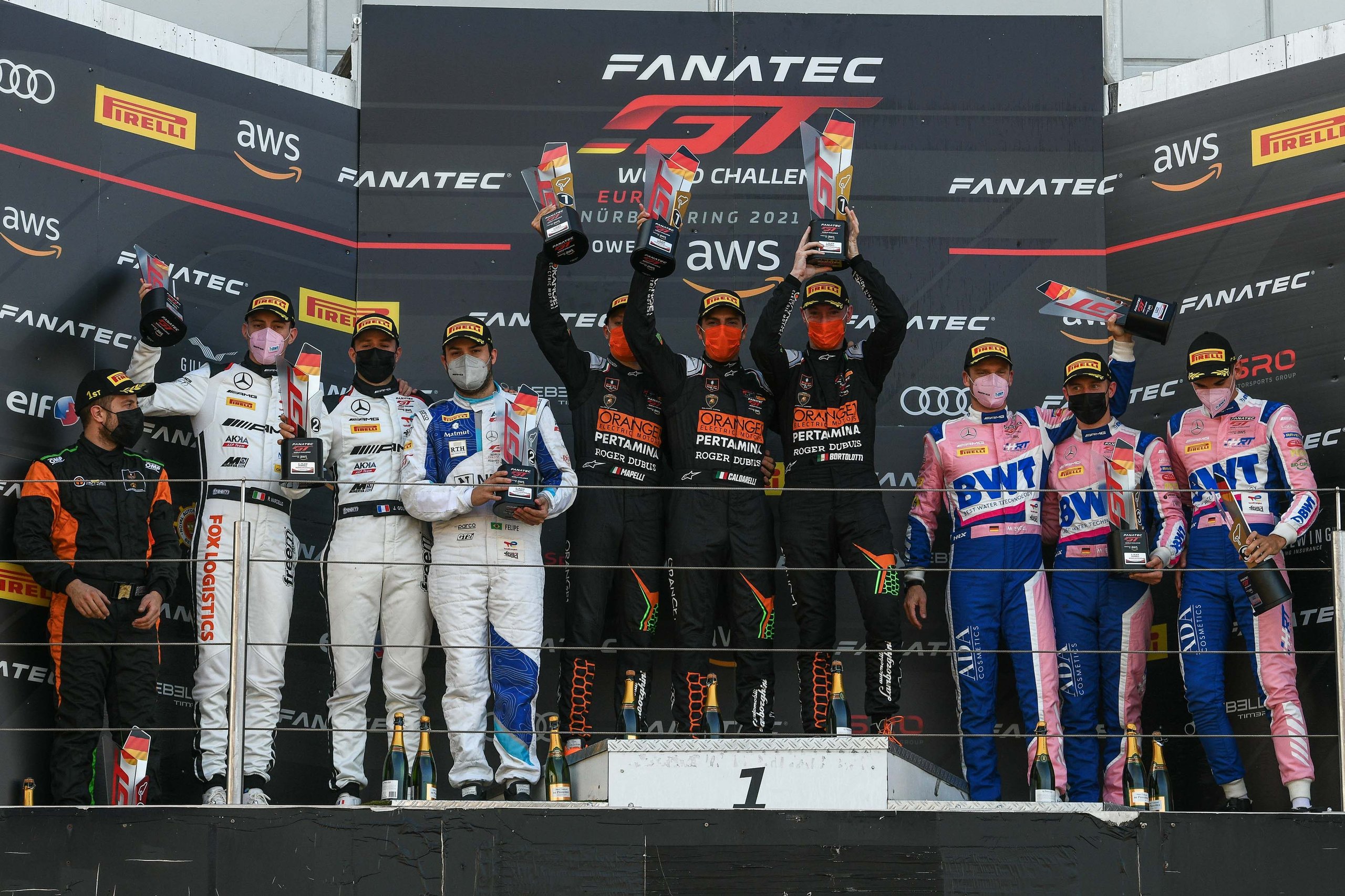 How Lamborghini'S 2021 Nürburgring Endurance Cup Win Built The Foundation For Its Gt3 Future 7 Lamborghini drivers and team members celebrating on the fanatec gt world challenge europe podium with trophies