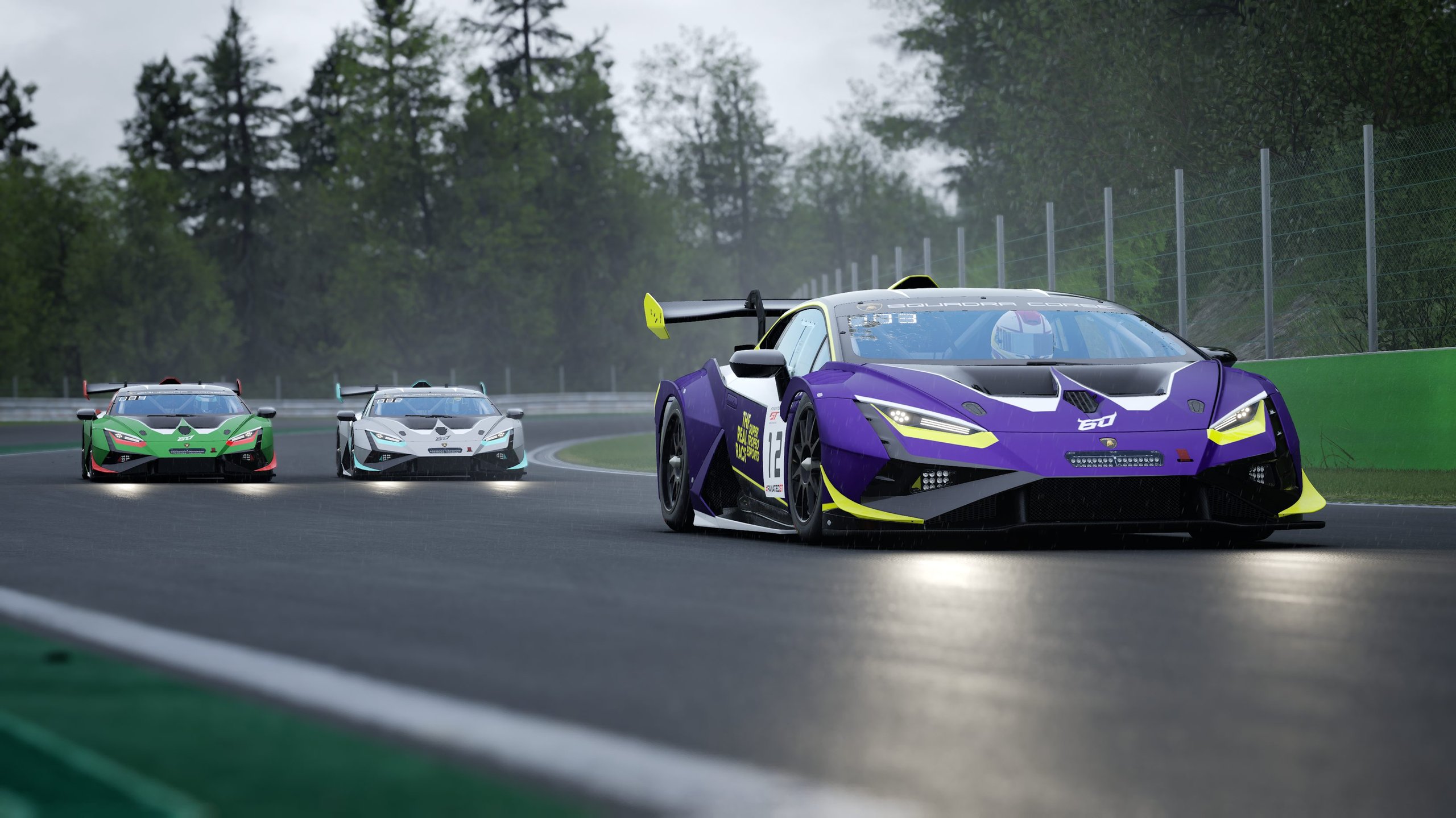 How Lamborghini'S 2023 Real Race Turned Sim Racers Into Factory Drivers 5 Three lamborghini huracán super trofeo evo2 race cars racing on a wet track under overcast skies, with the purple car leading