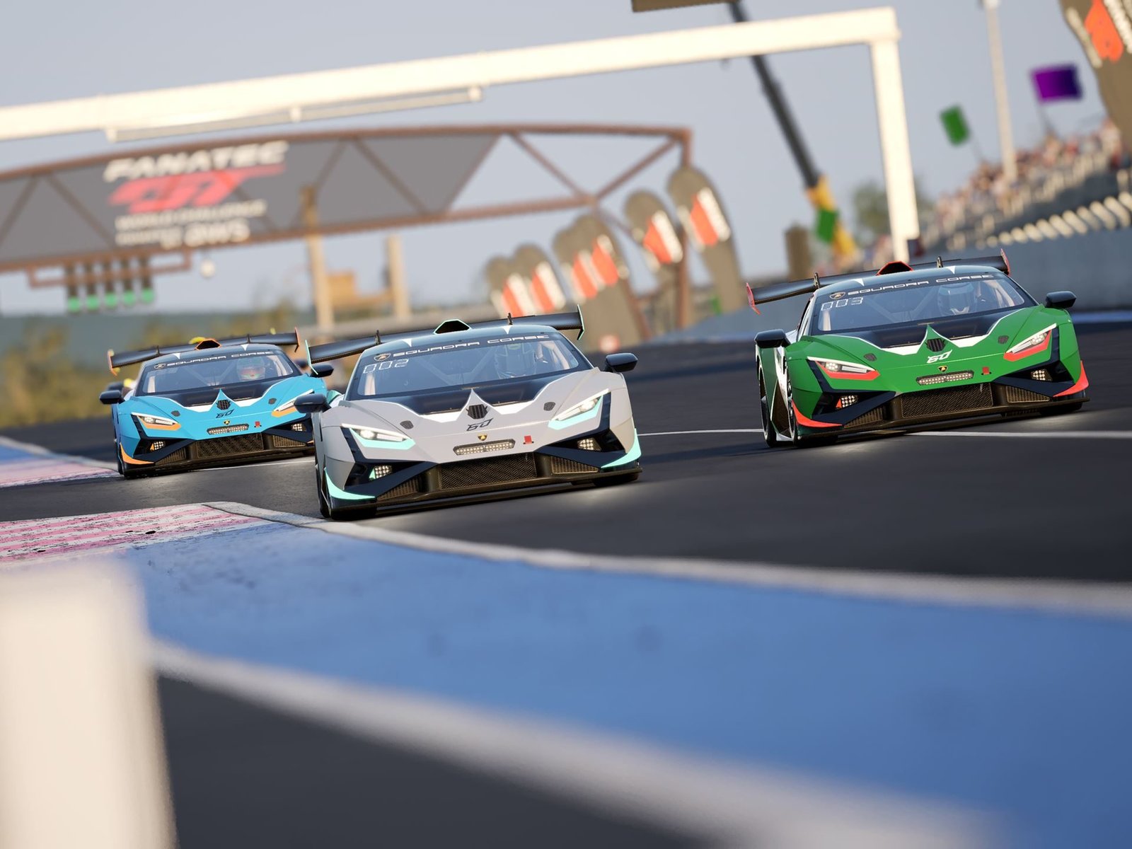 Three Lamborghini Huracán Super Trofeo EVO2 race cars in white, blue, and green liveries racing in tight formation on a circuit