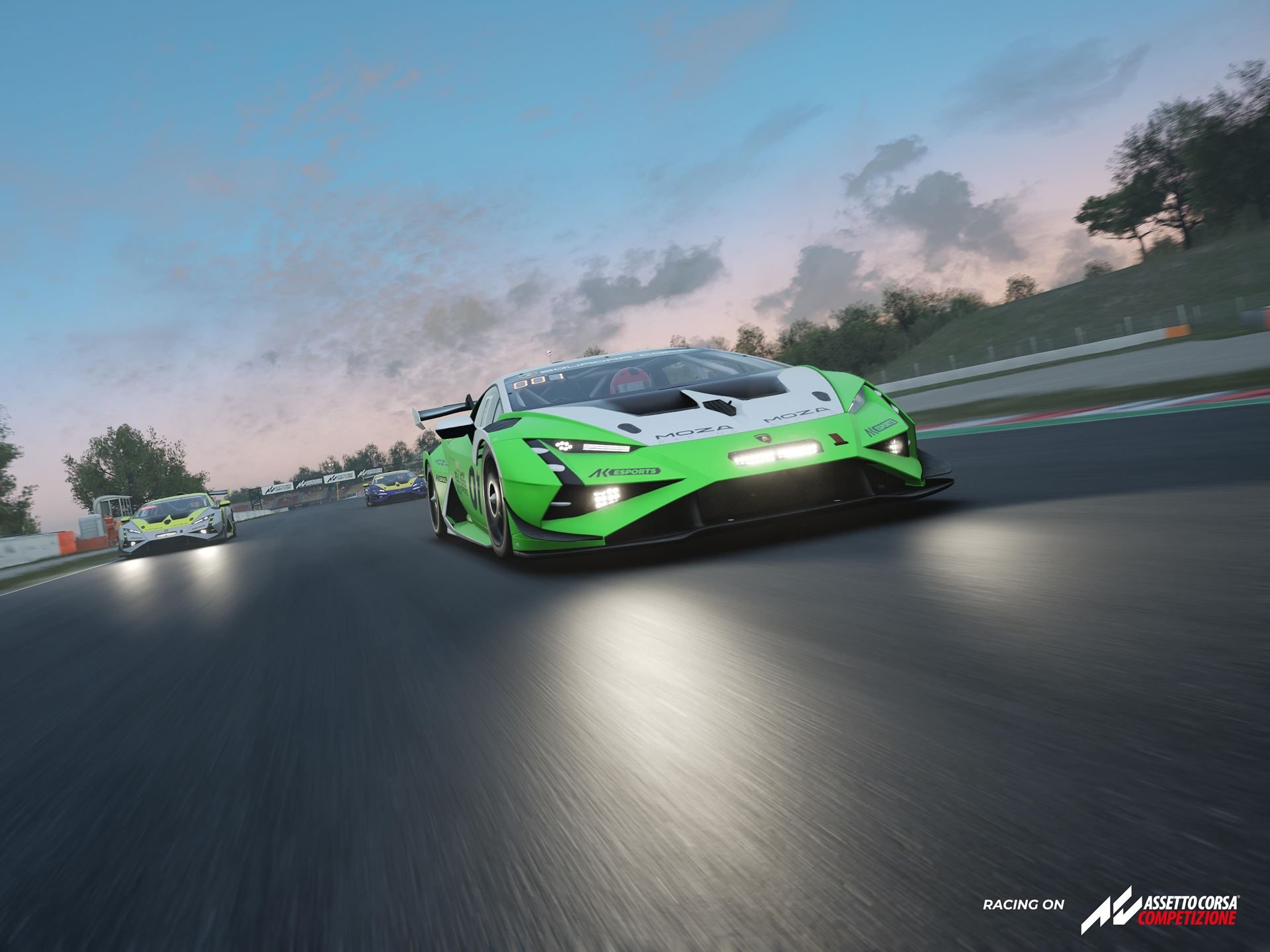 Green and white lamborghini huracán gt3 evo2 speeding down a track with headlights illuminated under cloudy skies