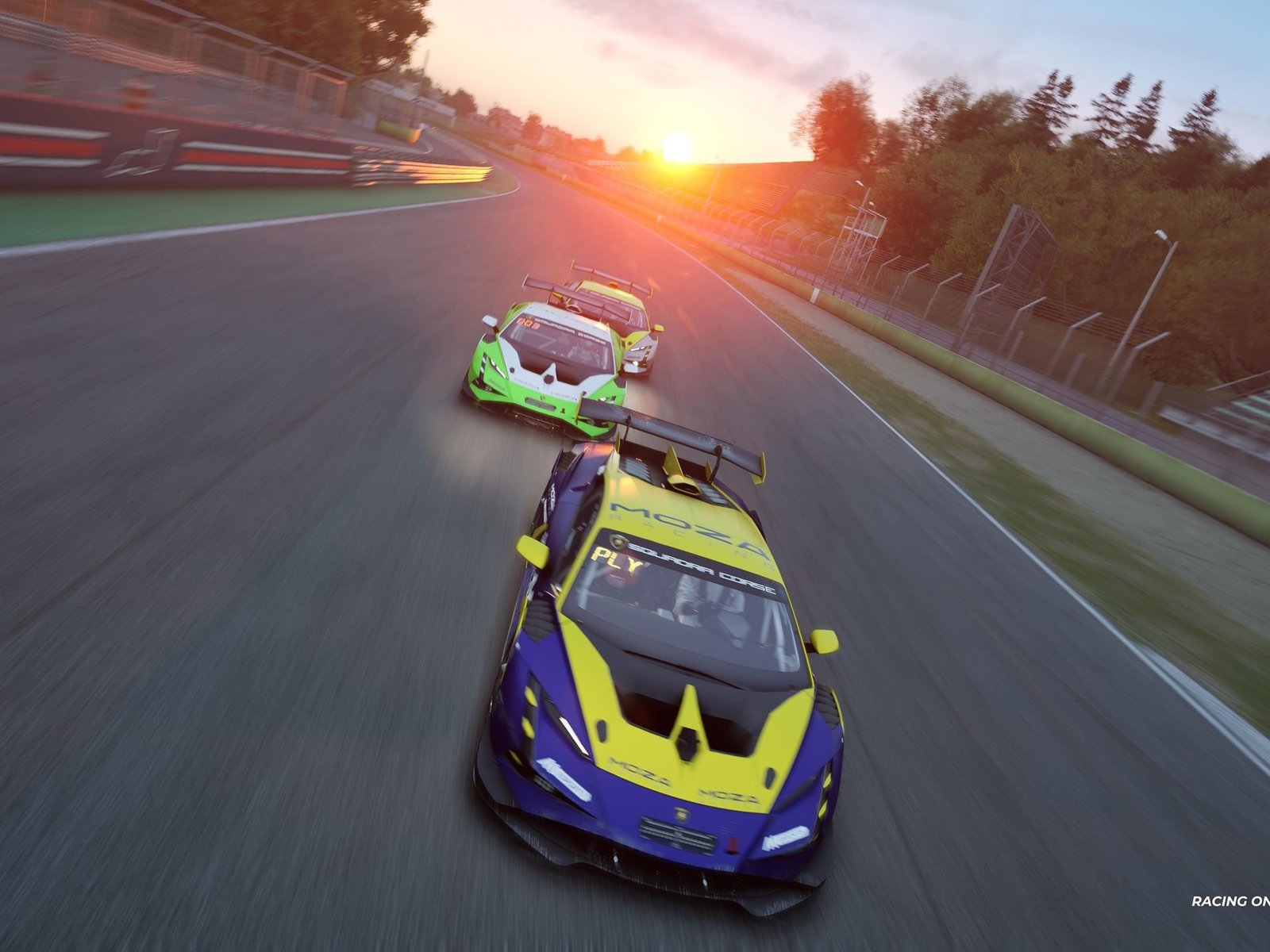 Three Lamborghini Huracán GT3 EVO2 race cars battling on track at sunset in blue-yellow and green-white liveries
