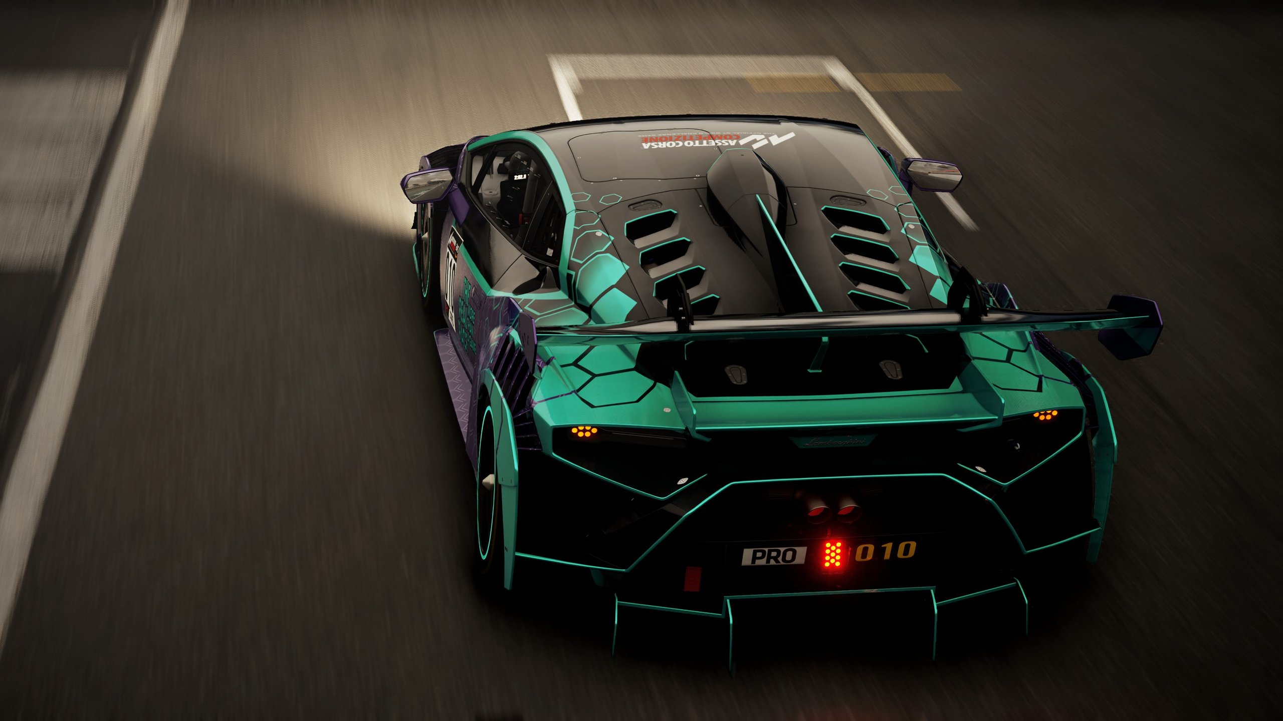 Lamborghini'S 'The Real Race' Offers Sim Racers A Factory Esports Seat, And That Changes The Talent Pipeline 7 Black, purple, and teal lamborghini huracán gt3 evo race car with hexagonal livery racing on a track at night