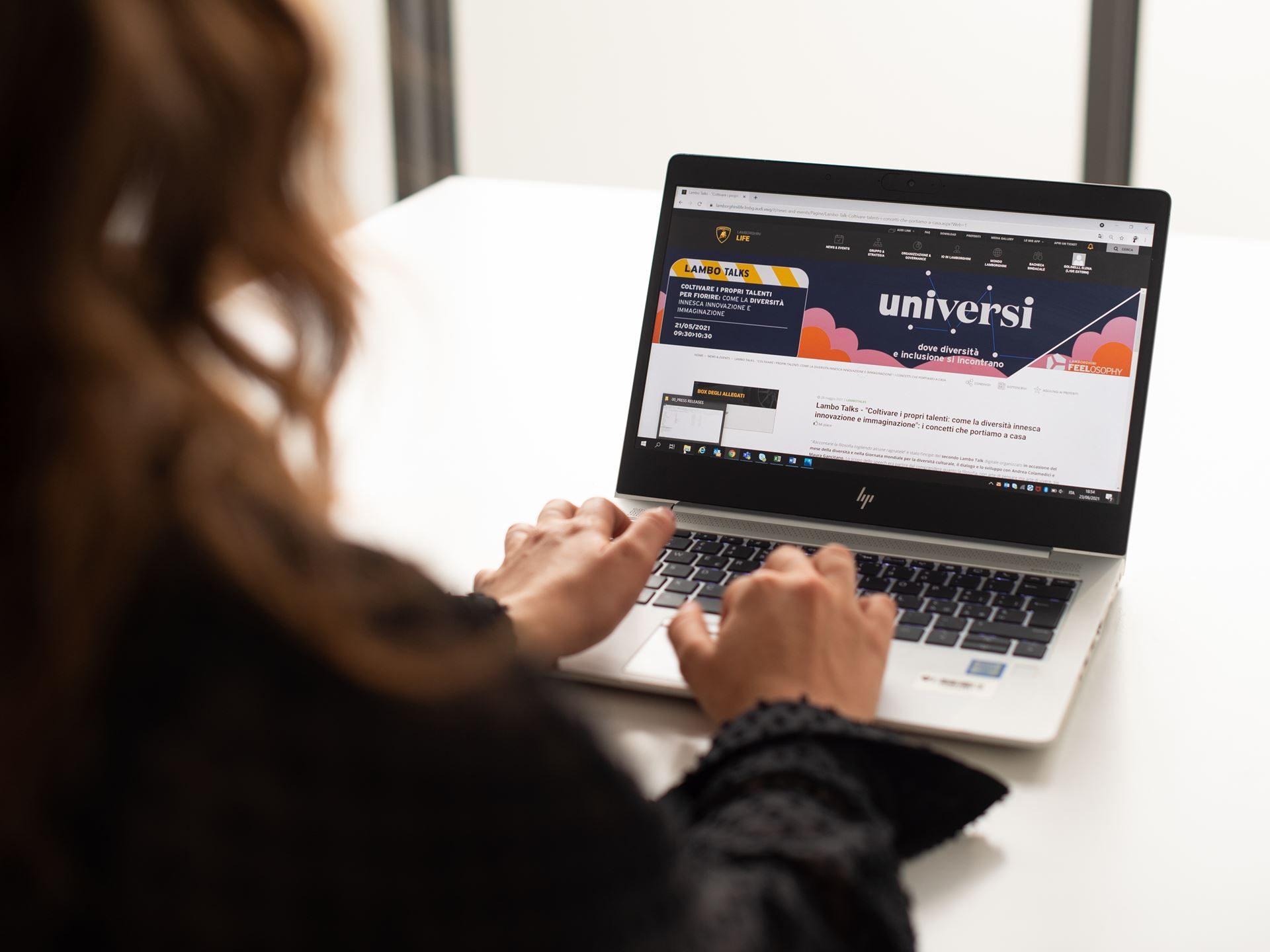 Lamborghini'S Feelosophy Program Bets That Better-Supported Employees Build Better Supercars 7 Lamborghini employee engaging with internal lambo talks communication platform on a laptop