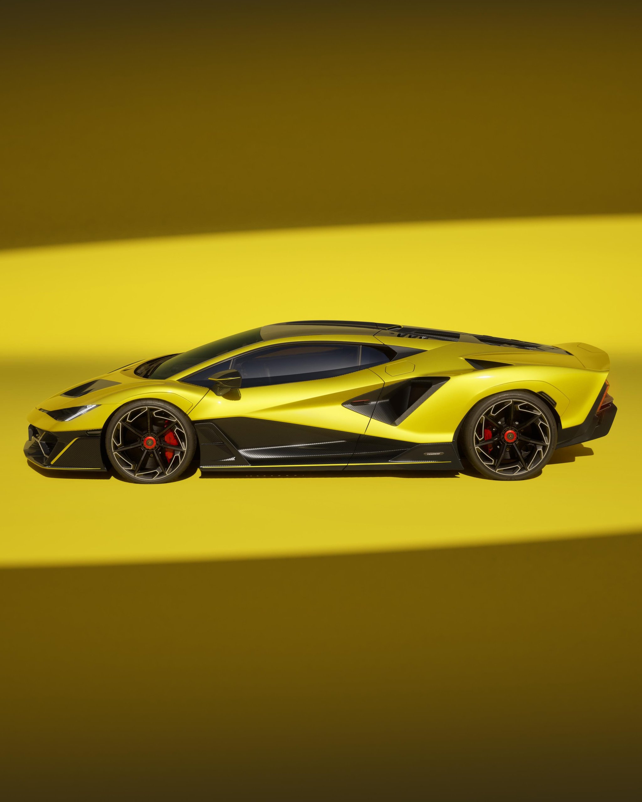 Lamborghini'S Fenomeno Wins Red Dot'S Highest Honor, And Its 'Hyper-Elegant' Design Tells Us Where The Brand Is Heading 3 Side profile of the yellow lamborghini fenomeno showing its sleek silhouette, prominent side air intakes, and continuous character line