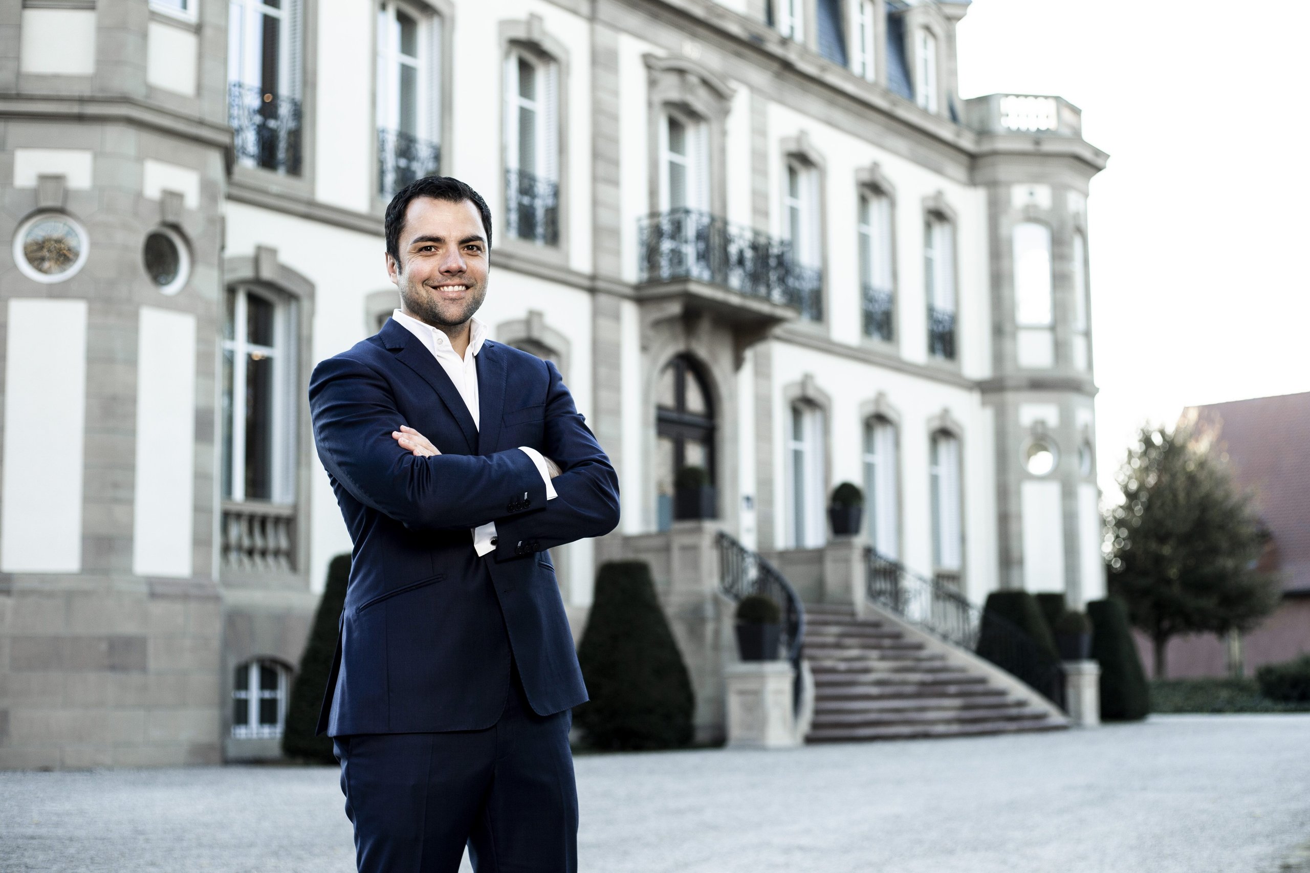 Lamborghini Puts One Executive In Charge Of Both Marketing And Sales, Hires Bugatti'S Comms Chief: Why It Matters 5 Portrait of federico foschini in a dark suit standing in front of a grand building