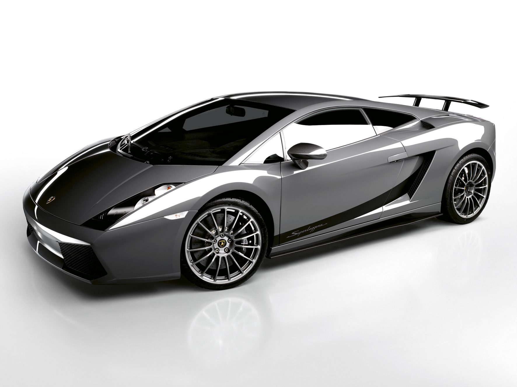 The Gallardo At 20: How Lamborghini'S First V10 Became The Blueprint For Every Modern Bull 9 Grey lamborghini gallardo superleggera in studio setting showing carbon fiber rear wing and aggressive styling