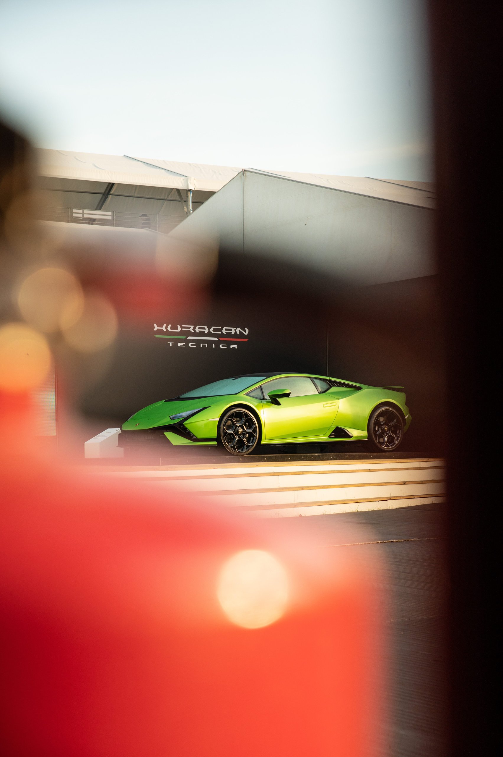 Lamborghini'S Goodwood Farewell: Why Sant'Agata Staged A Last Call For Naturally-Aspirated Power In Front Of 450 Owners 5 Green lamborghini huracán tecnica displayed on a platform with branded backdrop