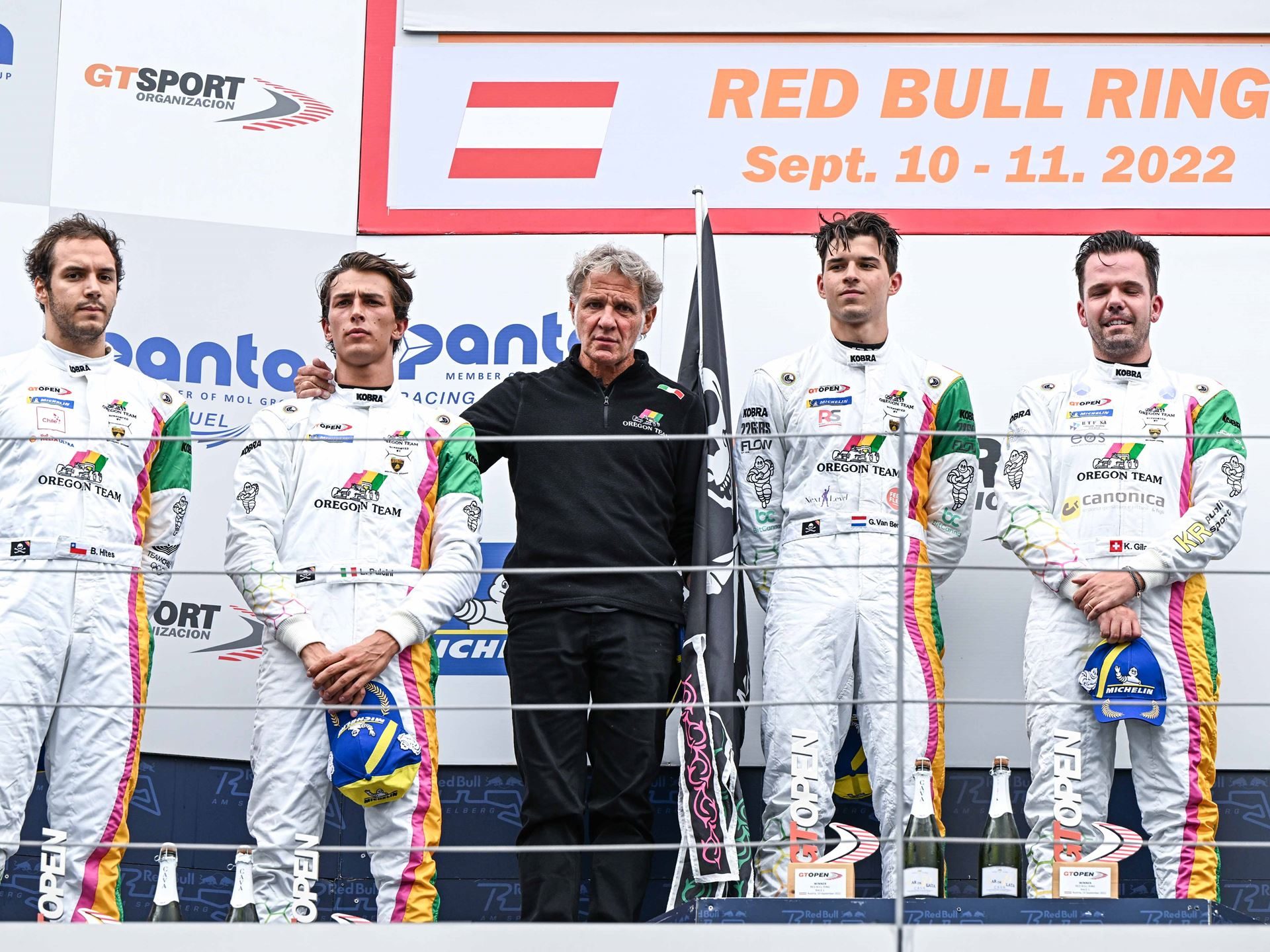 Oregon Team'S Red Bull Ring Sweep Put Two Huracán Gt3 Evos At The Top Of The Gt Open Standings, Then The Real Fight Began 7 Oregon team crew celebrating on the podium with trophies and champagne at the red bull ring