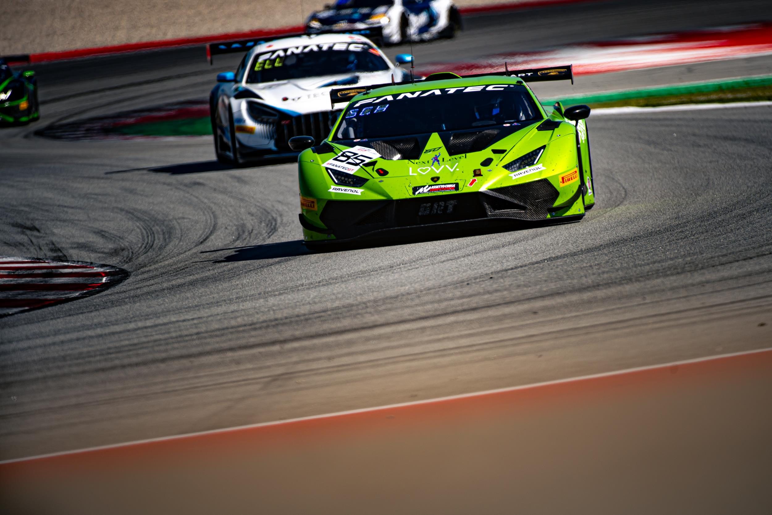 Huracán Gt3 Evo2 Clinches Silver Cup Title At Barcelona As Lamborghini'S V10 Racer Writes Its Final Championship Chapters 3 Bright green lamborghini huracán gt3 evo2 race car speeding around a corner at a racetrack with competitors visible behind