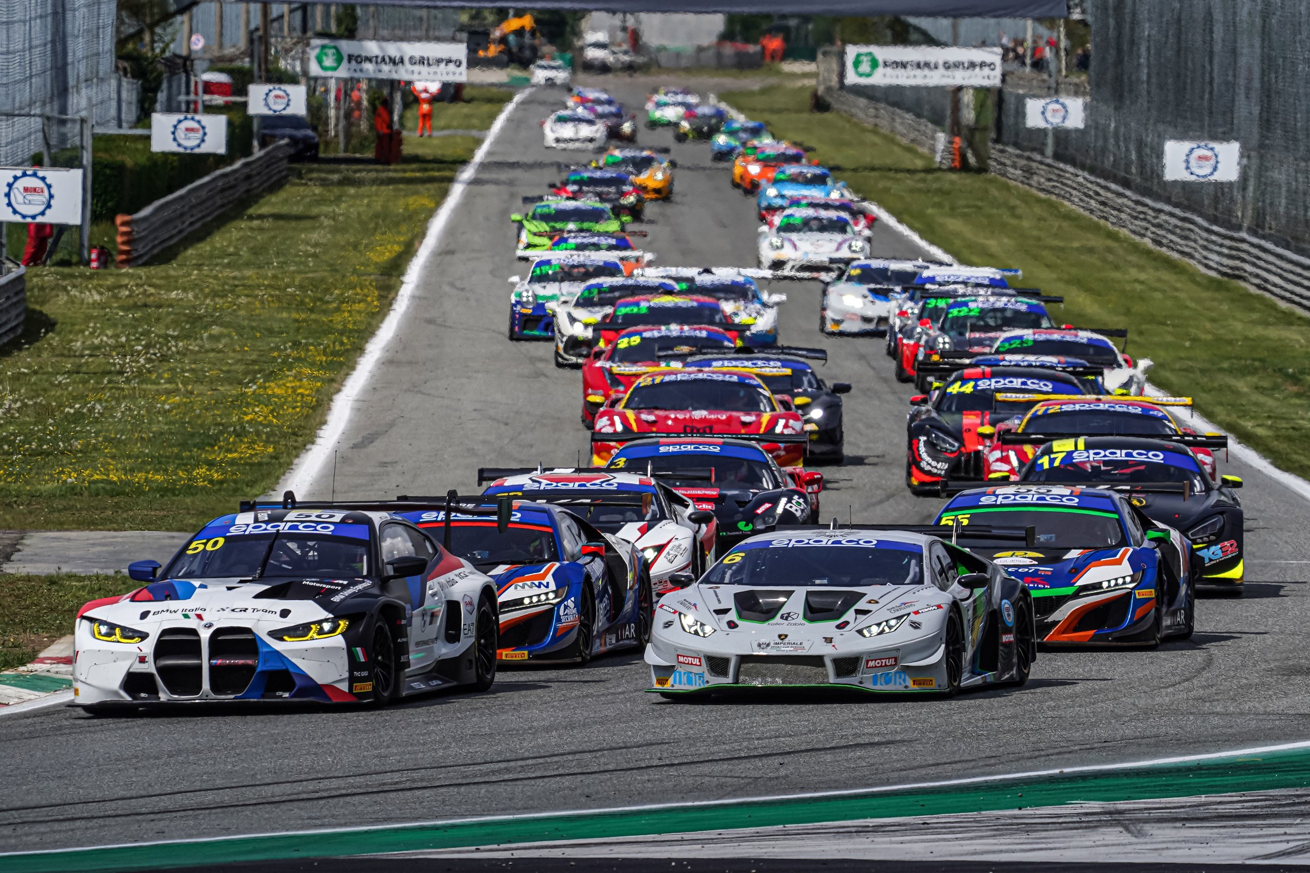Di Folco'S Solo Monza Victory Proves The Huracán Gt3 Evo Still Bites Hard 5 Grid of gt race cars including a white lamborghini huracán gt3 evo lined up on track before the start