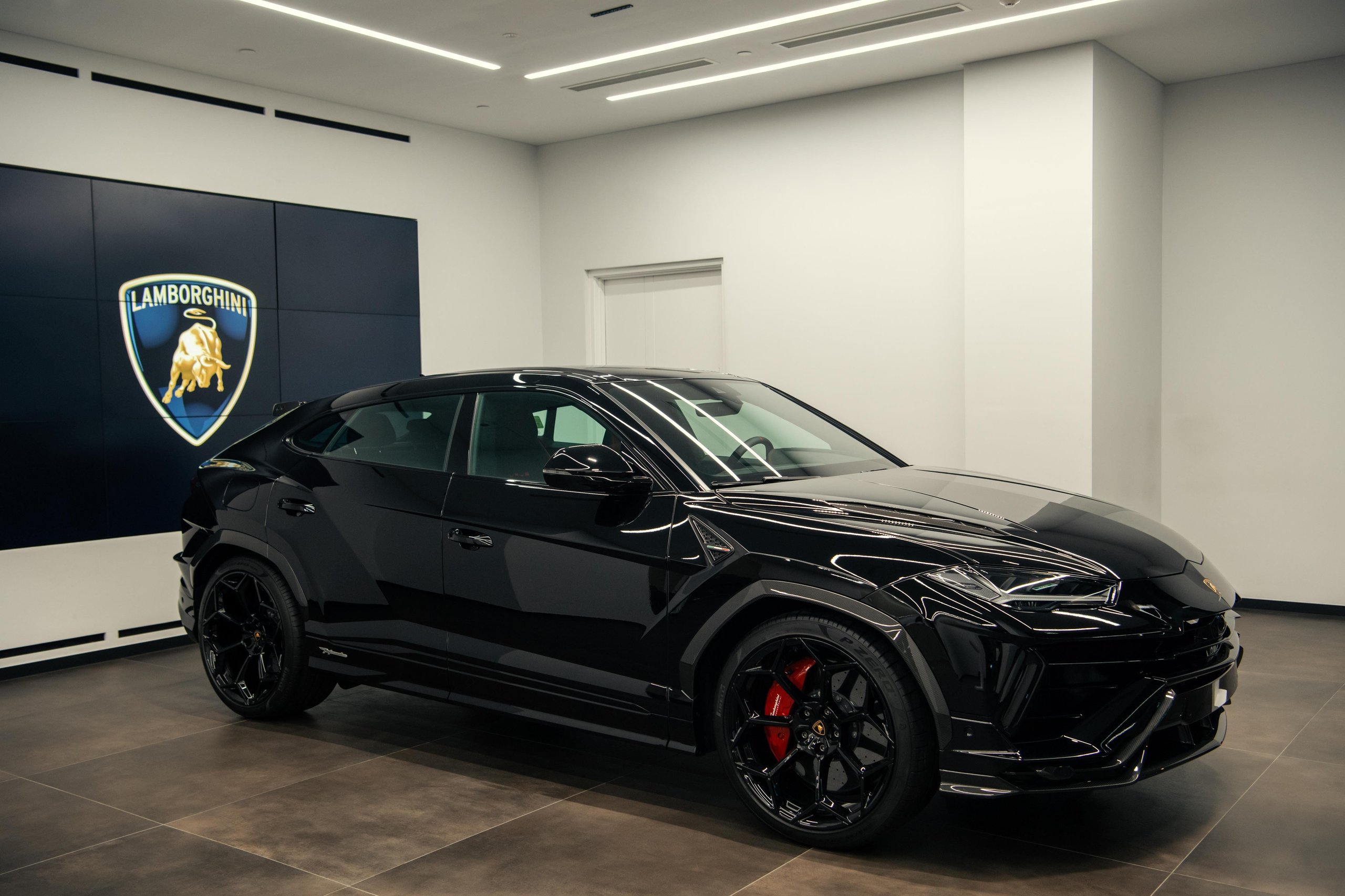 Lamborghini Plants Its Flag In Vietnam With A Ho Chi Minh City Showroom That Doubles As A 60Th Anniversary Statement 7 A black lamborghini urus displayed prominently inside the new lamborghini ho chi minh city showroom with the brand logo visible in the background