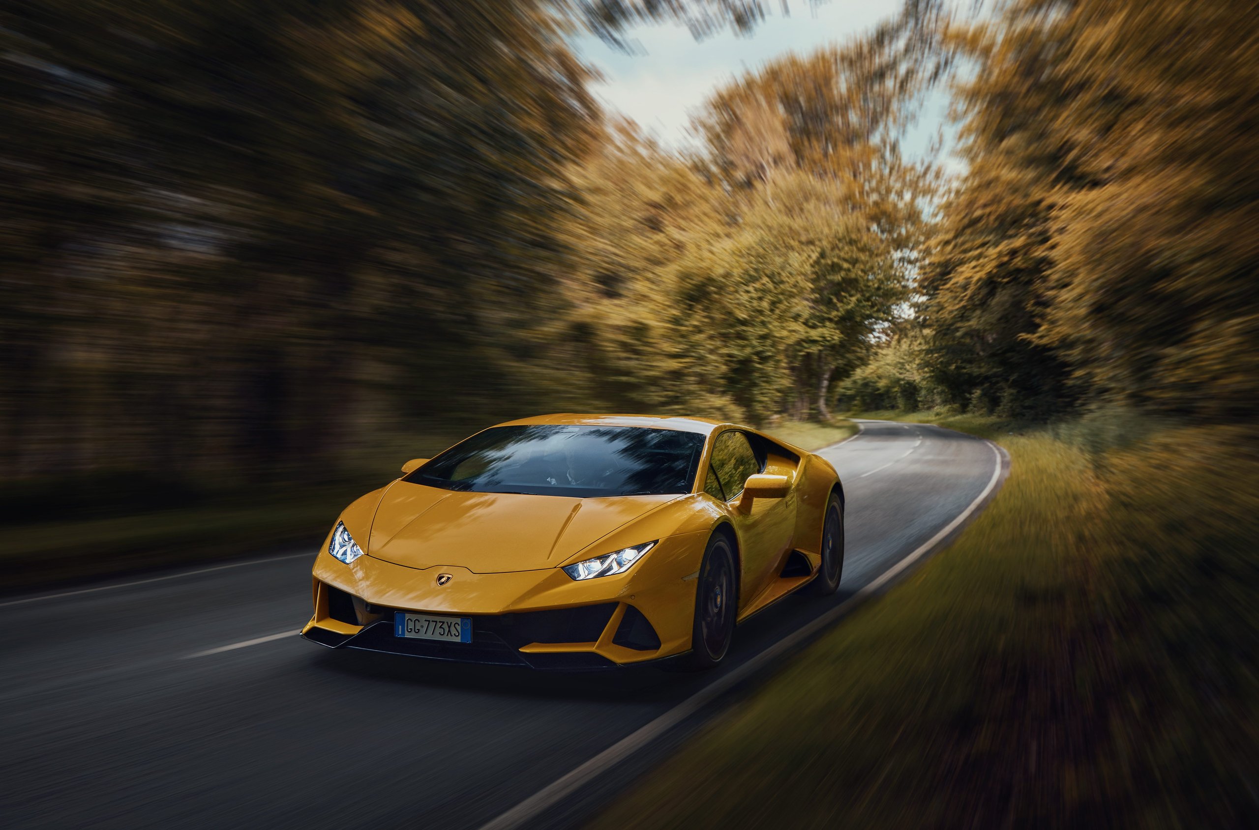 Goodwood 2022: How Lamborghini Used The Duke Of Richmond And Four Cars To Stage A Love Letter To Naturally Aspirated Power 5 Yellow lamborghini huracán tecnica driving on a winding forest road with motion blur indicating speed