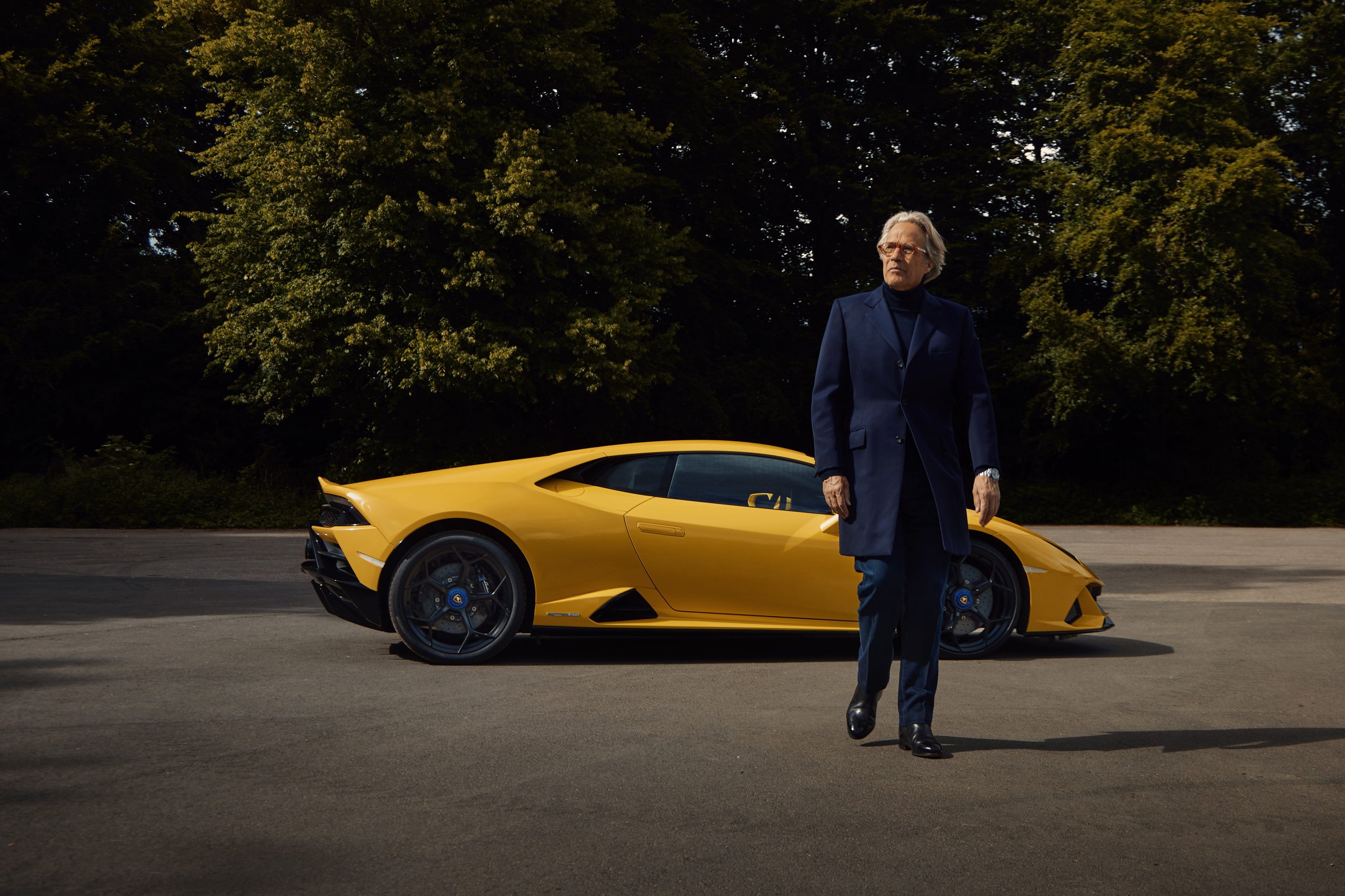 Goodwood 2022: How Lamborghini Used The Duke Of Richmond And Four Cars To Stage A Love Letter To Naturally Aspirated Power 11 The duke of richmond walking away from a yellow lamborghini huracán tecnica showing its aggressive rear diffuser and black wheels with yellow brake calipers