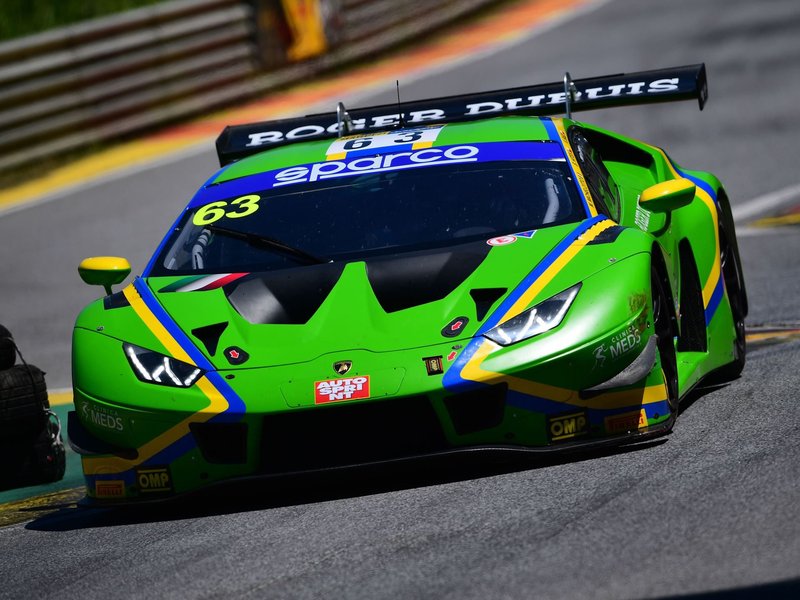 Lamborghini Huracán GT3 number 63 at speed showing front splitter, canards, and large rear wing