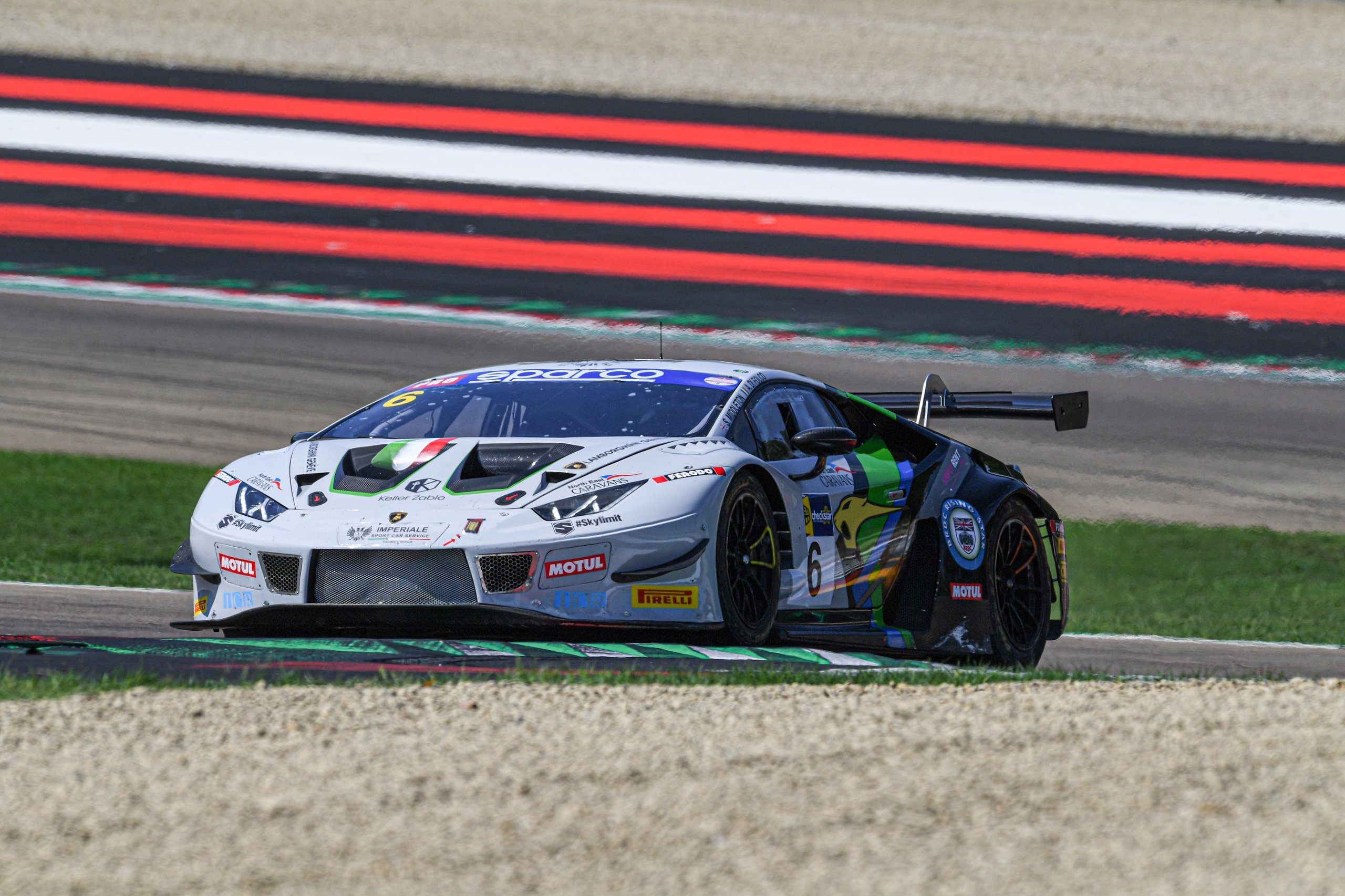 How Imperiale Racing'S Eight-Tenths-Of-A-Second Imola Win Proved The Huracán Gt3 Evo Still Bites 3 Lamborghini huracán gt3 evo number 6 navigating a turn at imola with red and white curbing visible