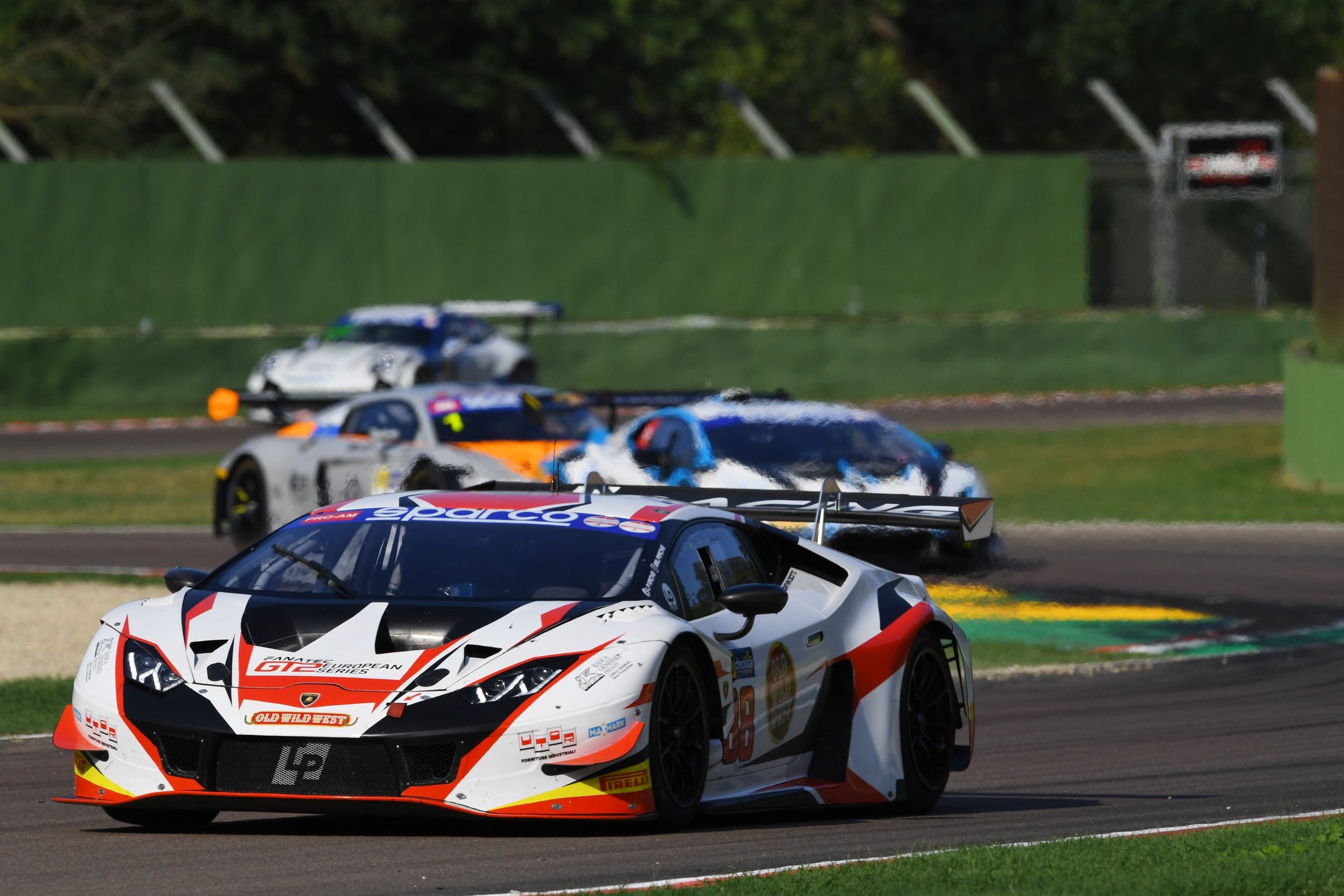 How Imperiale Racing'S Eight-Tenths-Of-A-Second Imola Win Proved The Huracán Gt3 Evo Still Bites 7 Lamborghini huracán gt3 evo number 19 leading a pack of race cars on a sunny track at imola