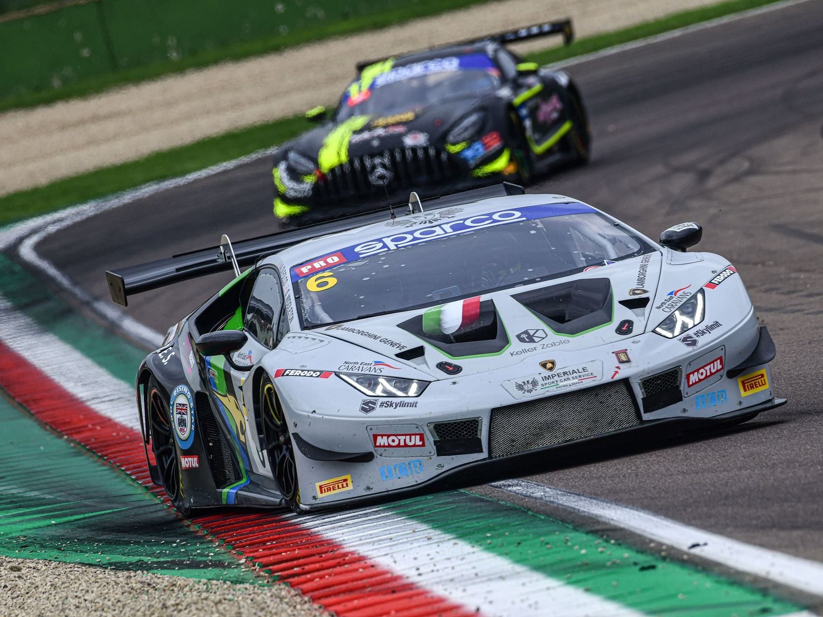 Imperiale Racing Lamborghini Huracán GT3 Evo number 6 cornering at Imola with a Mercedes-AMG GT3 in pursuit