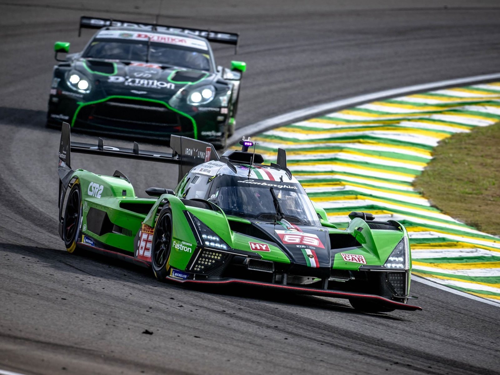 Green Lamborghini SC63 Hypercar leading on track during FIA World Endurance Championship racing