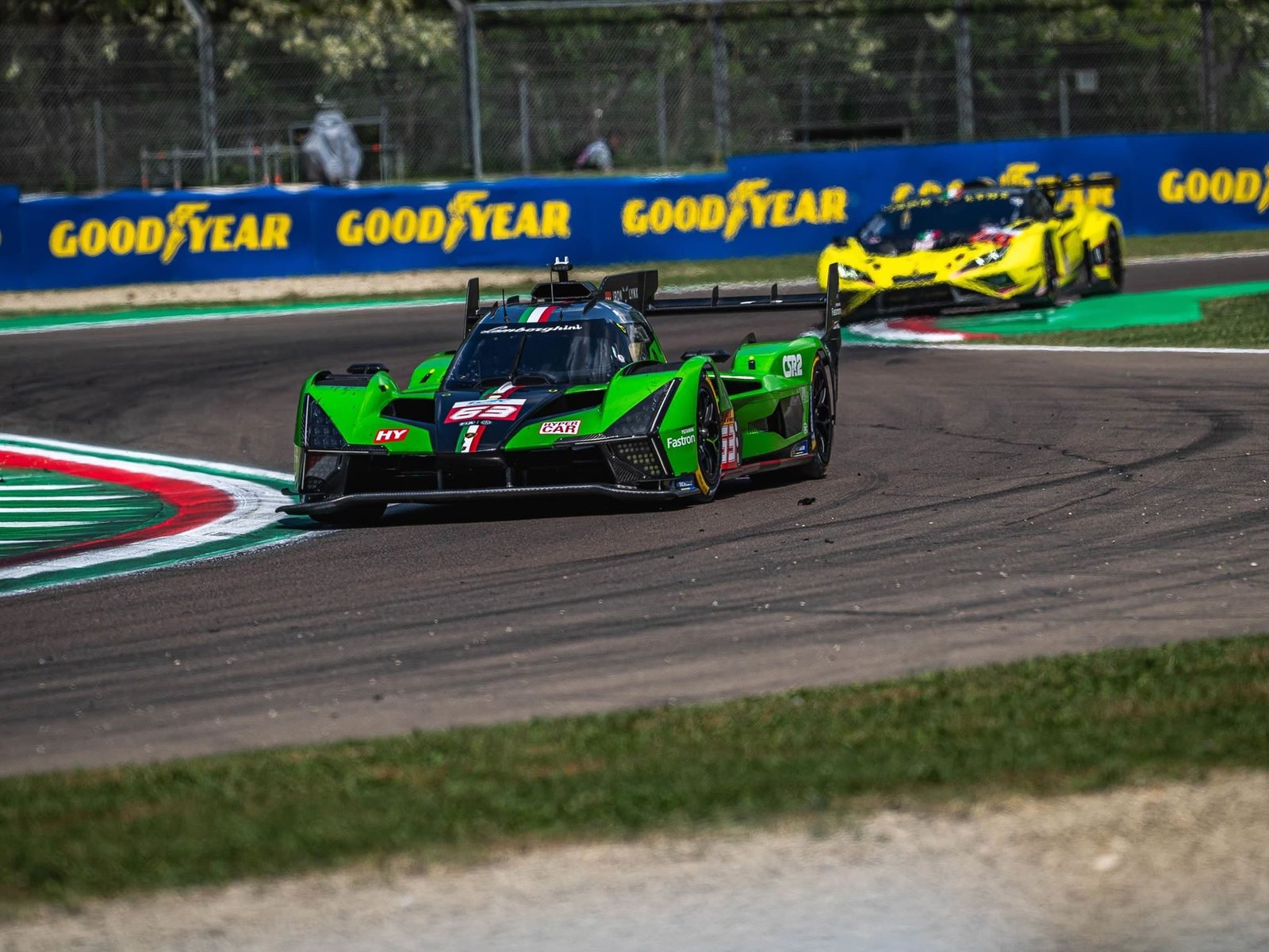 Lamborghini SC63 Hypercar leads a yellow Huracán GT3 EVO2 on track, showcasing the brand's dual racing presence